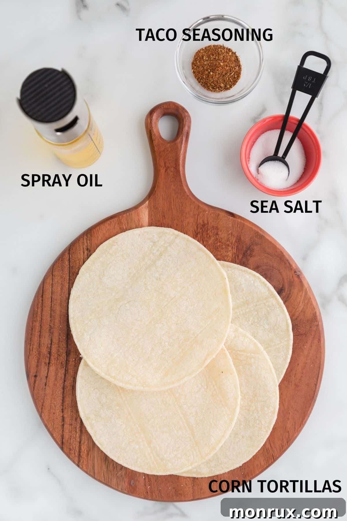 Tortillas, oil, and seasoning on a white surface.