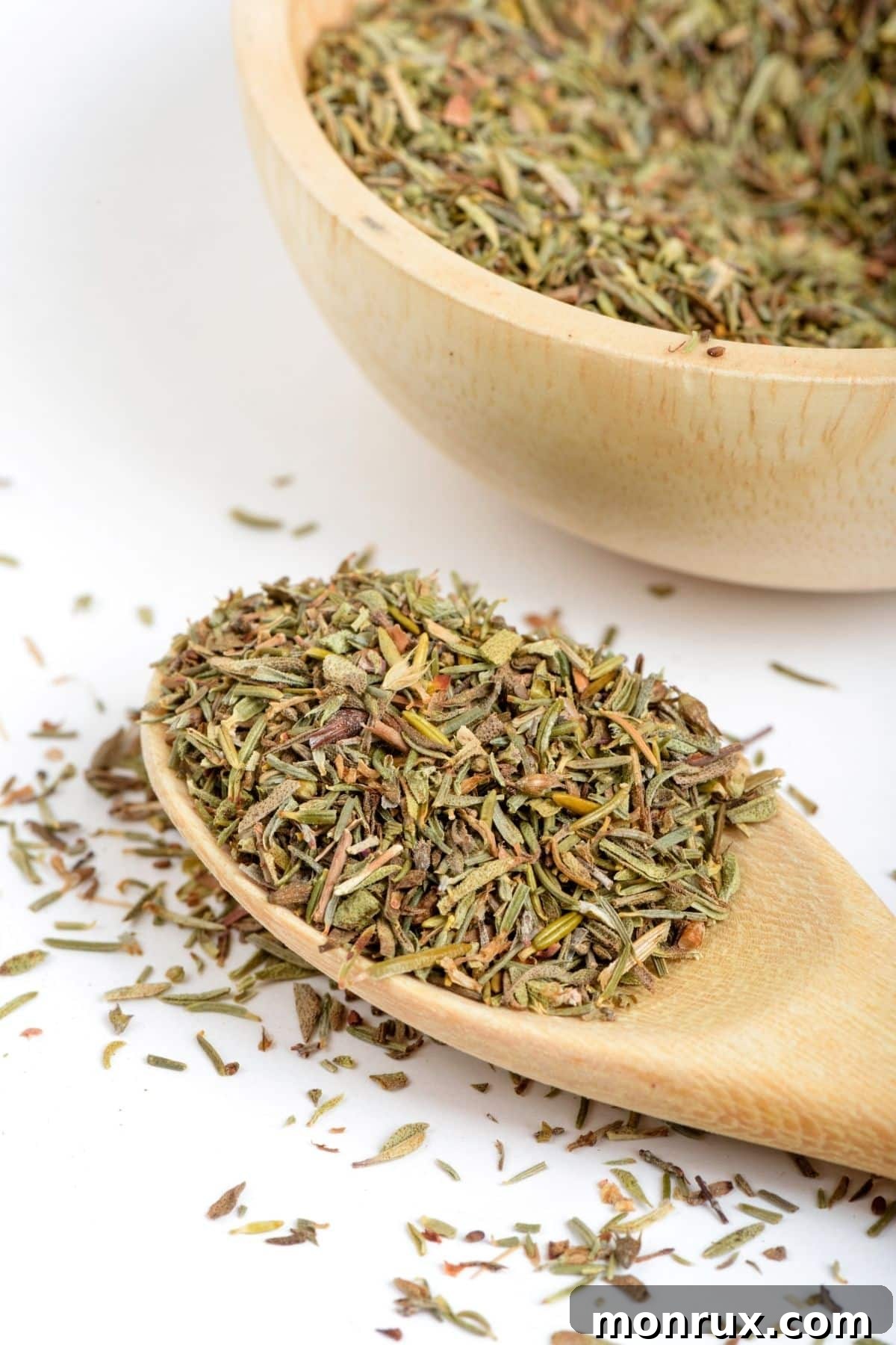 Dried thyme on a wooden spoon.