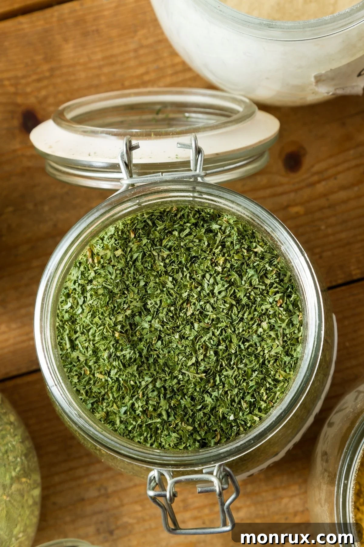 A jar filled with dried Italian seasoning blend.