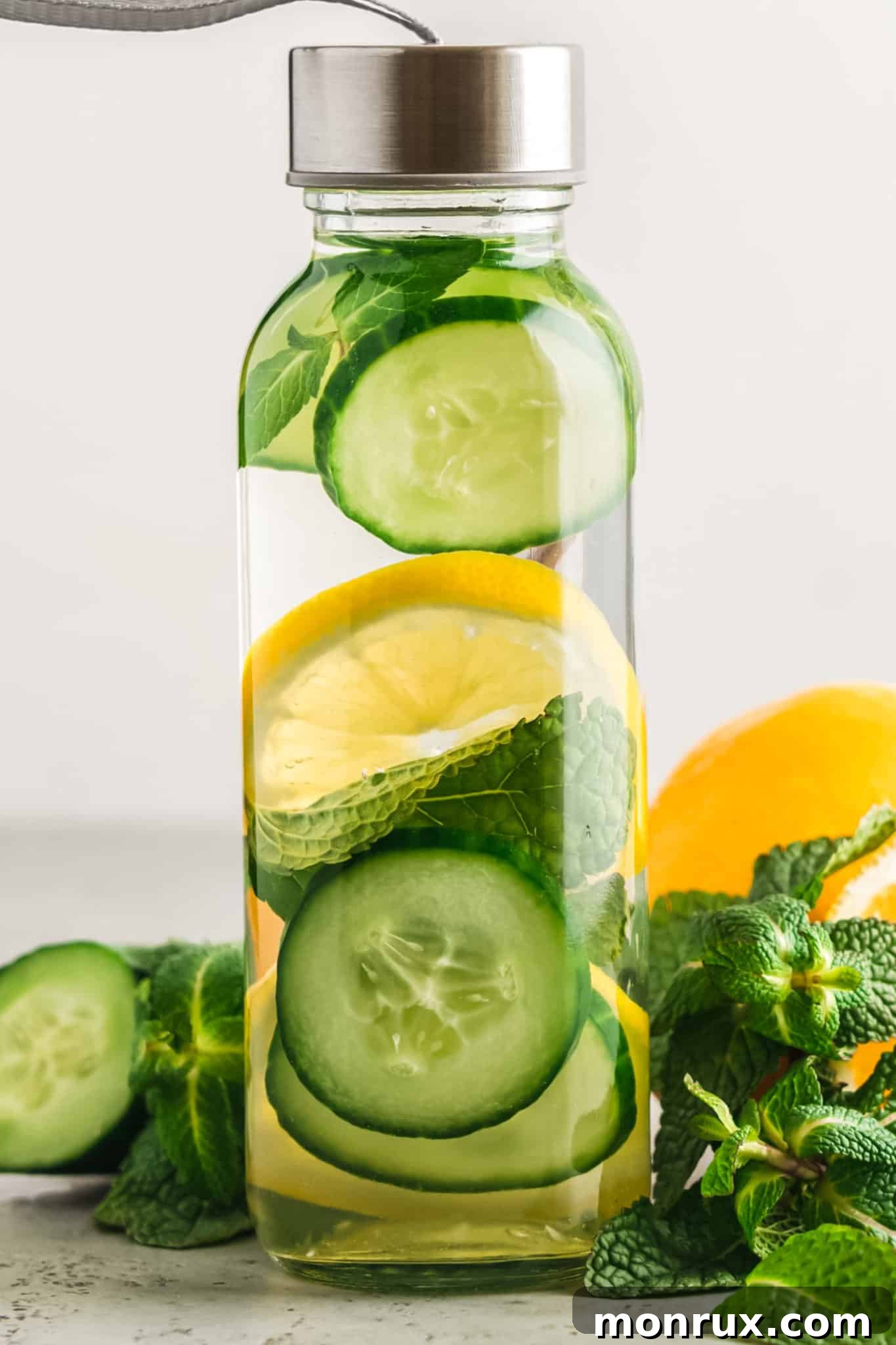 A rustic jar filled with colorful flavored fruit water, showcasing an assortment of fruit slices and herbs, hinting at a delightful and healthy beverage choice.