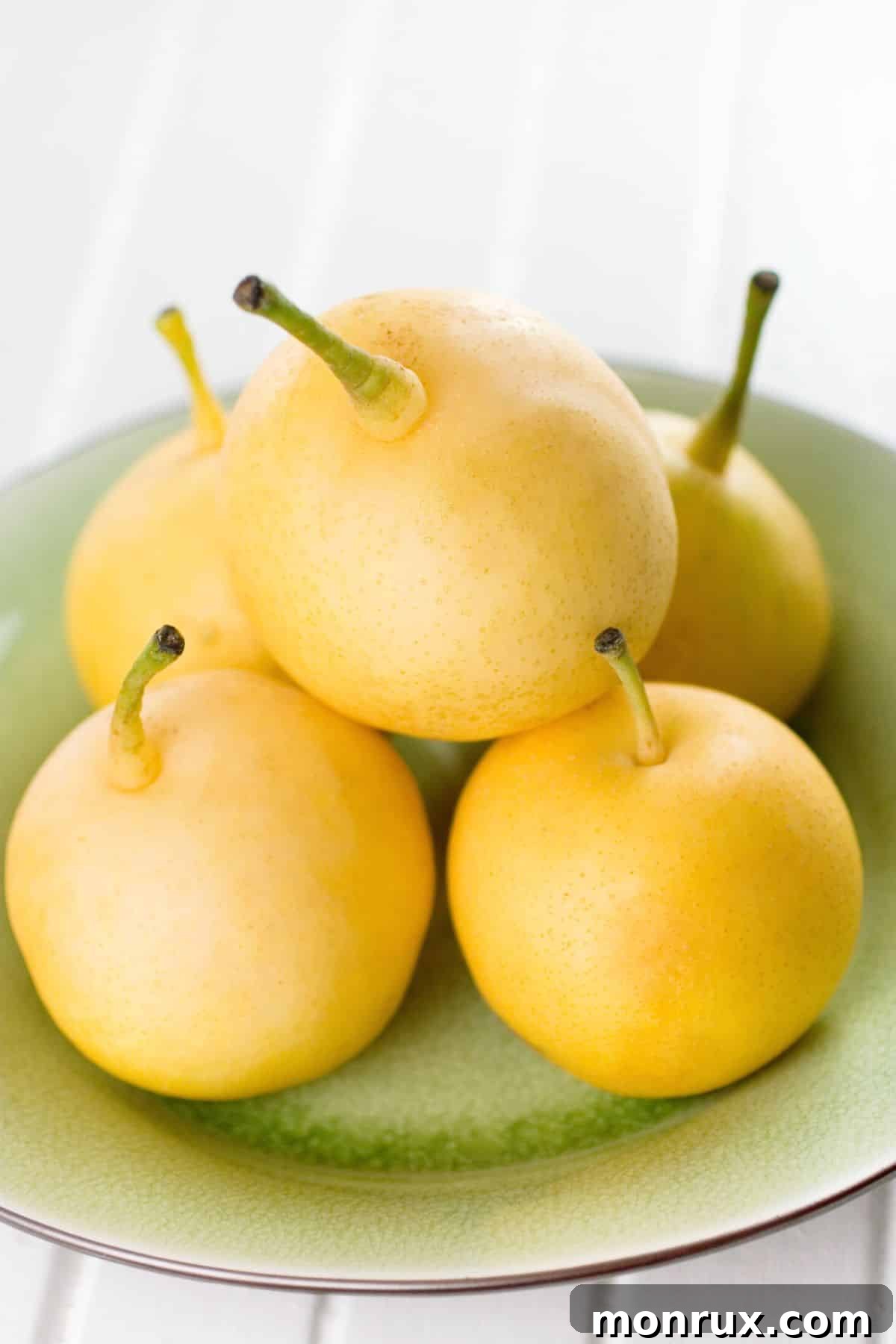 A bowl filled with crisp and juicy Asian pears.
