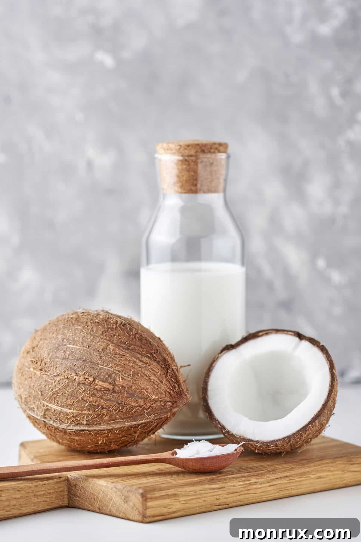 A fresh coconut with coconut milk, highlighting its versatility.
