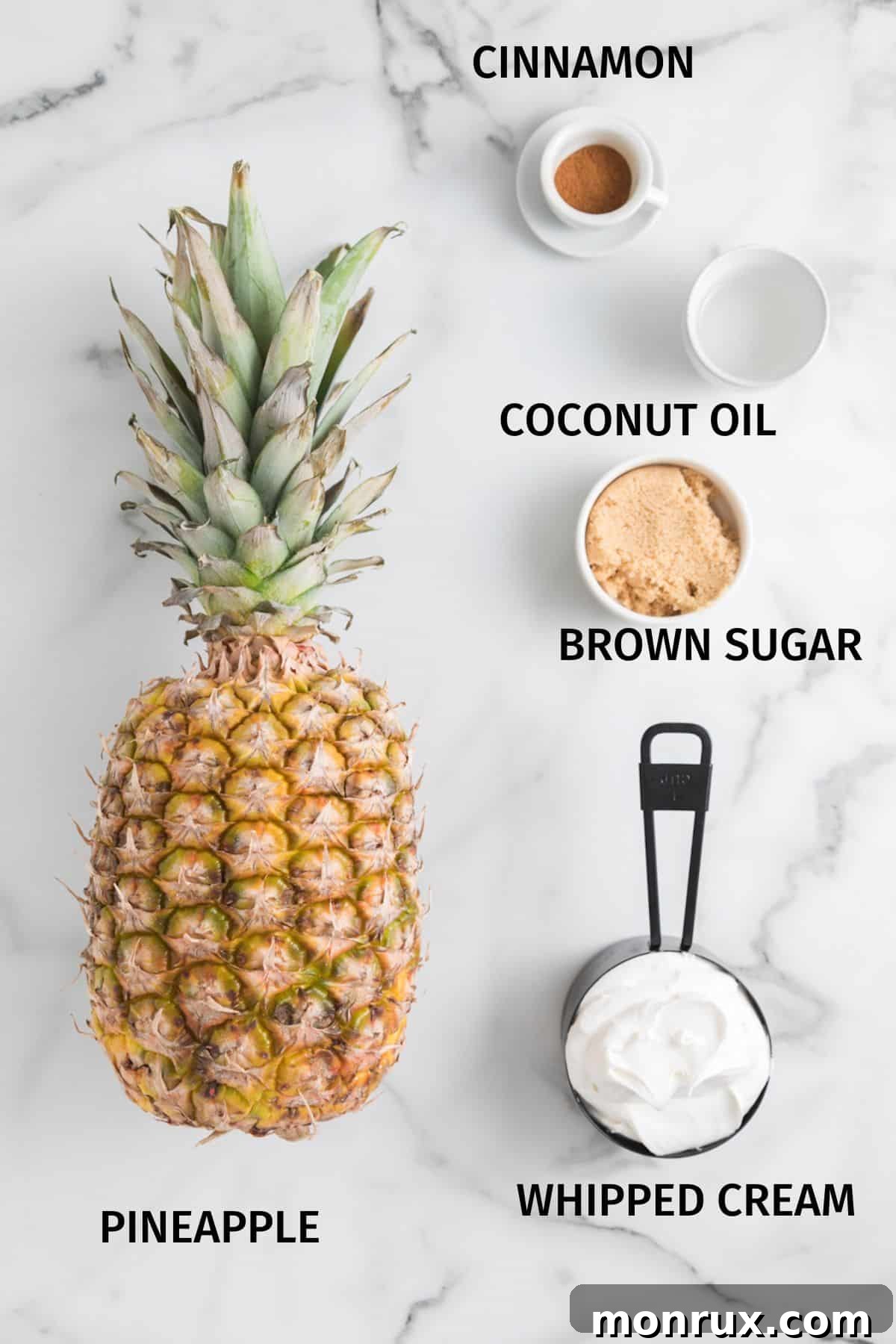 Ingredients for air fried pineapple rings on a white surface.