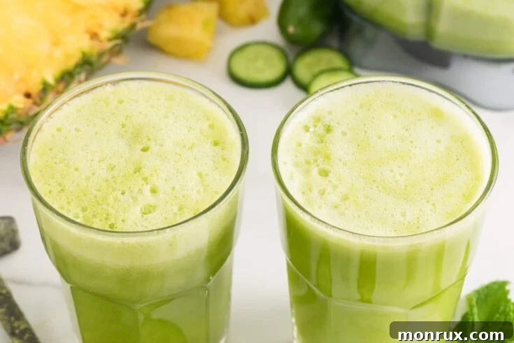 Two glasses of refreshing cucumber pineapple smoothie.