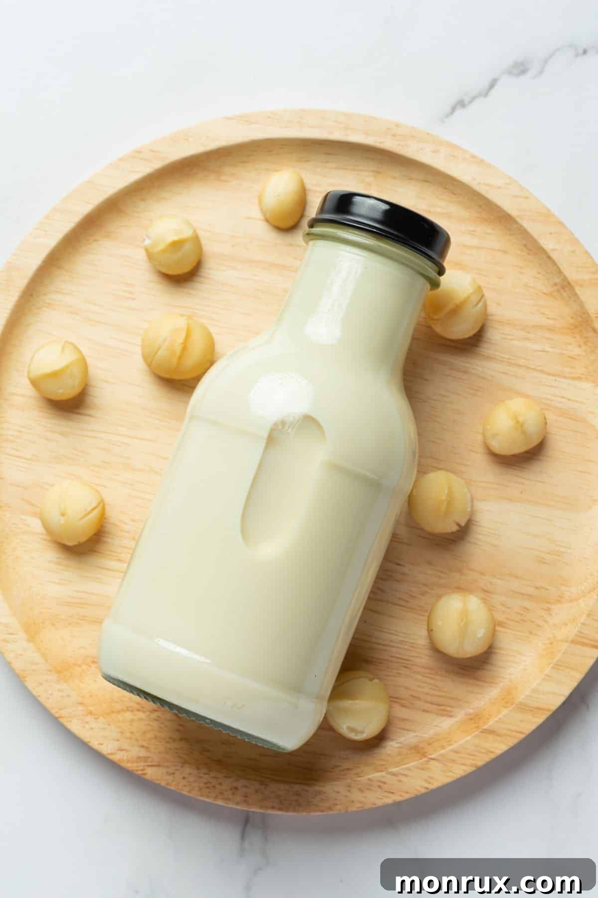 Jar of freshly made homemade macadamia nut milk, ready to be enjoyed.