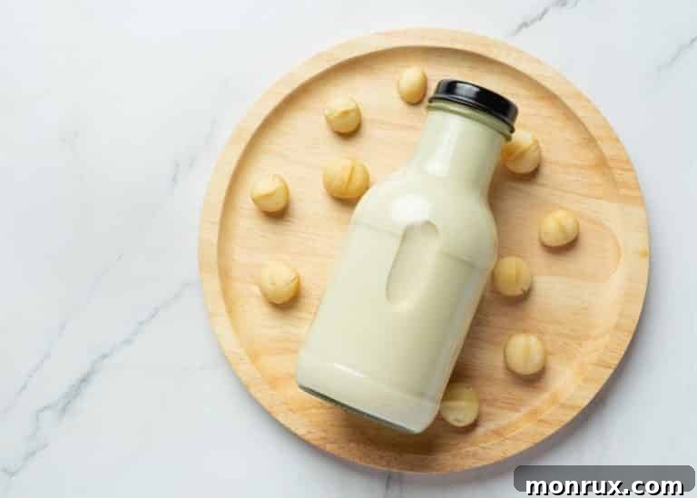 A jar of rich macadamia nut milk on a decorative tray, ready to be served.