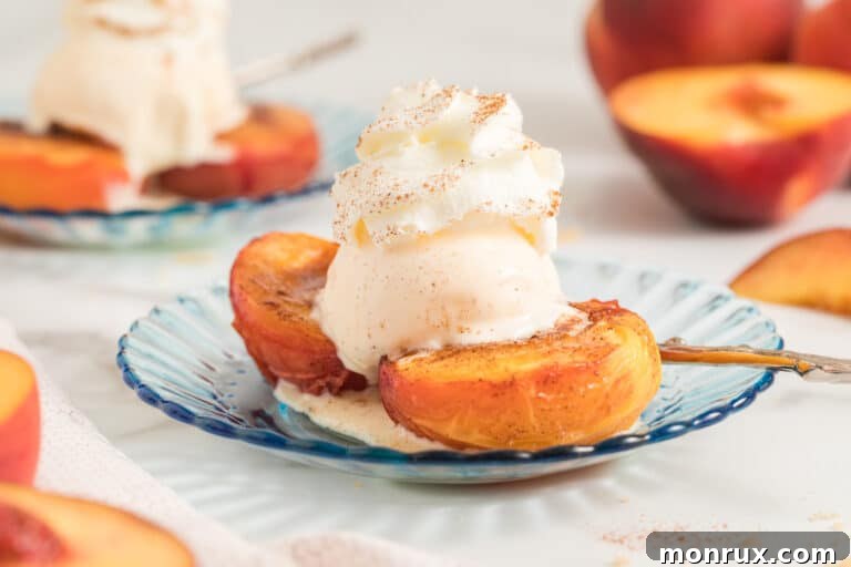 Two halves of perfectly air fried peaches, golden and caramelized, resting beautifully on a wooden cutting board, showcasing their inviting texture.
