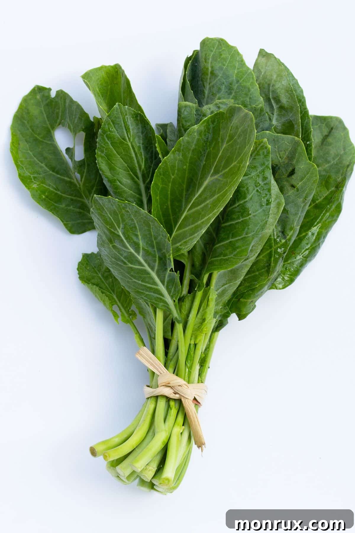 A vibrant bunch of fresh collard greens, ready for a healthy juice blend.