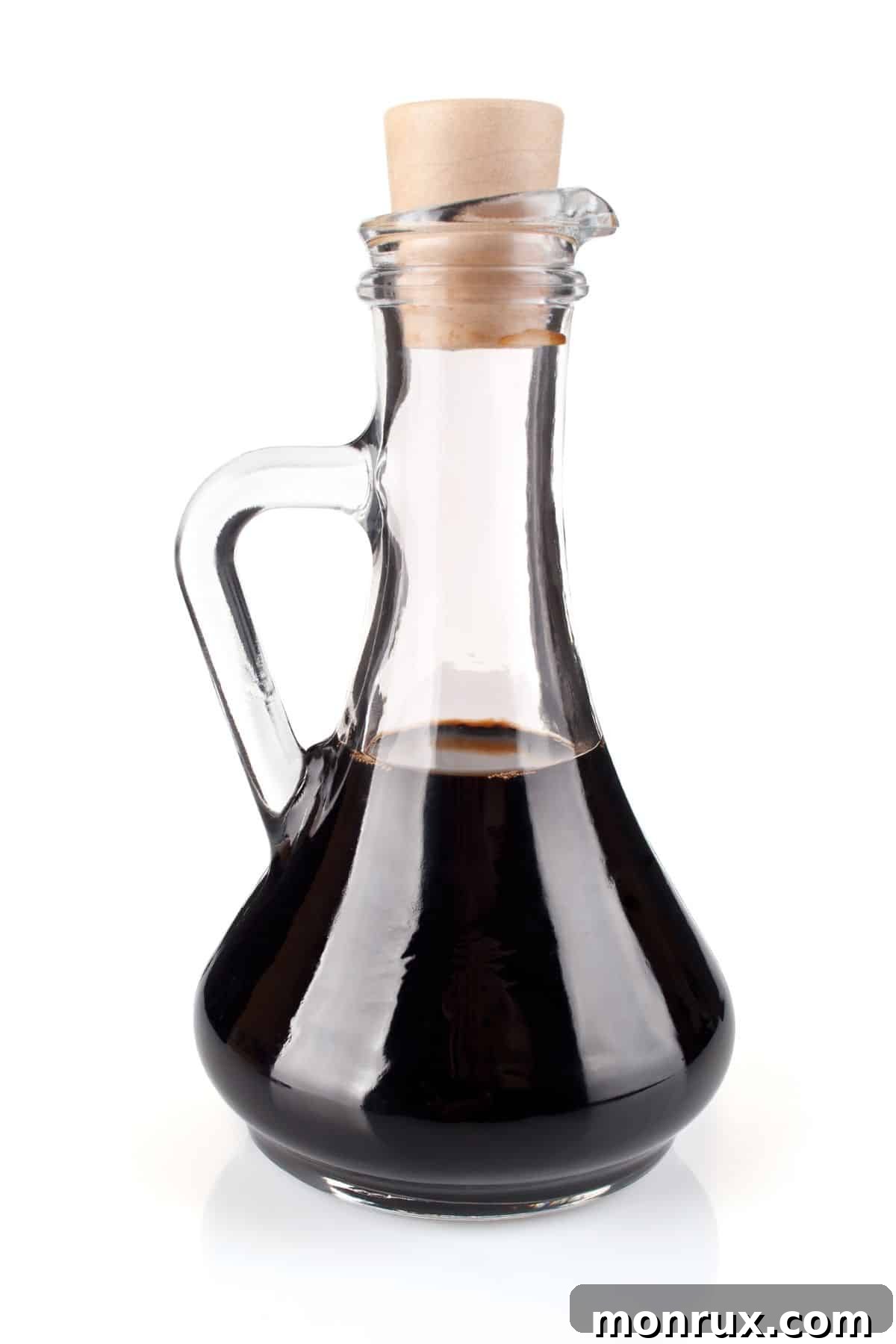 Bottle of balsamic vinegar with corked top.