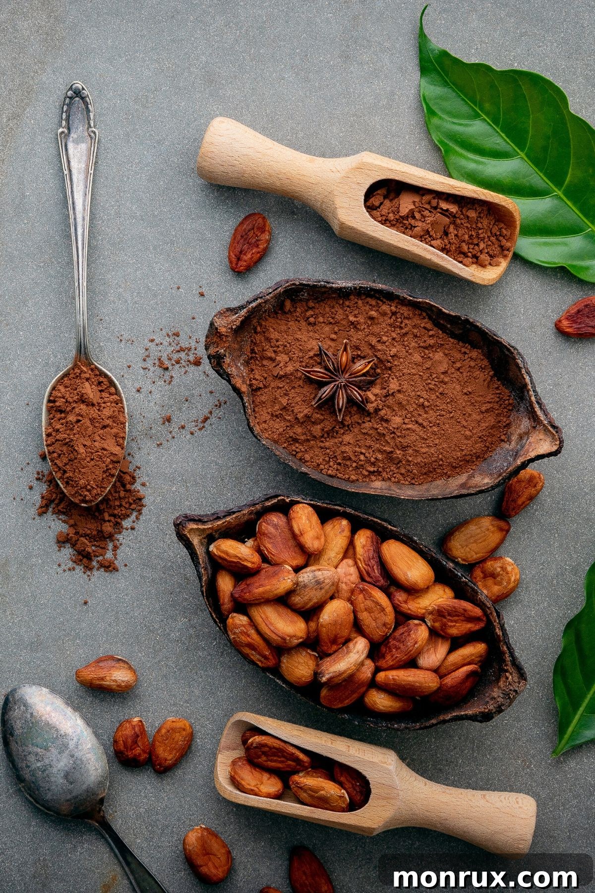 Bowls of different cocoa powder substitutes like baking chocolate, cacao powder, and carob powder, with spoons on a rustic wooden table, illustrating alternatives to cocoa powder.