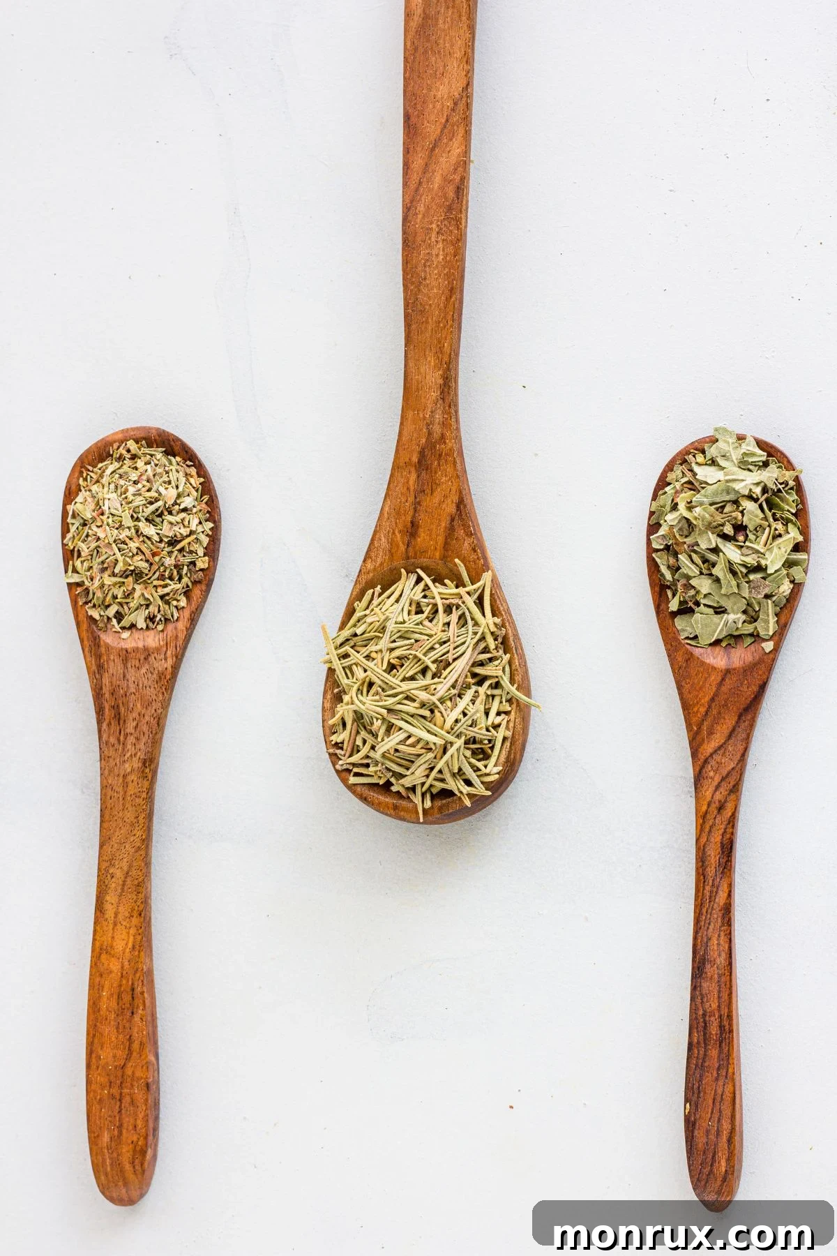 Dried basil, oregano and rosemary for Italian Seasoning, ingredients for a homemade blend.