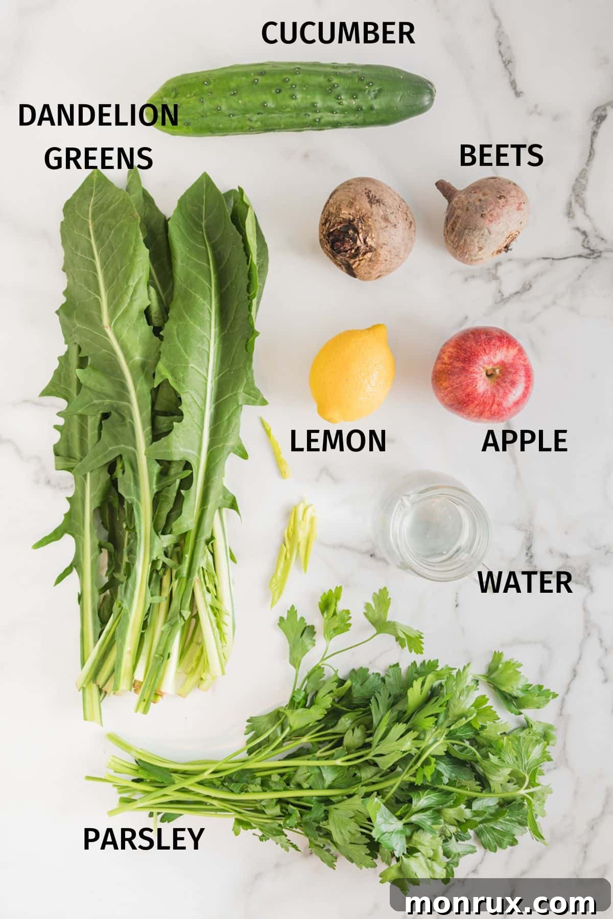 Fresh ingredients for making liver cleanse juice, including beets, lemons, dandelion greens, and parsley, arranged on a white background.