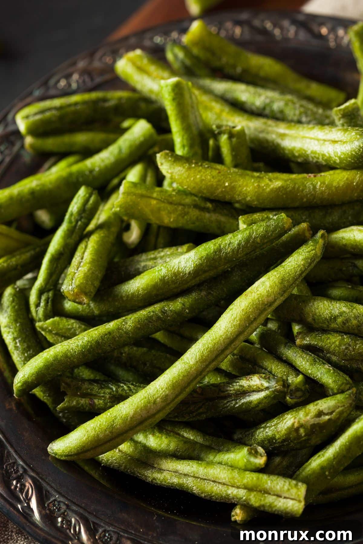 Dehydrated green beans in a metal bowl on the table.