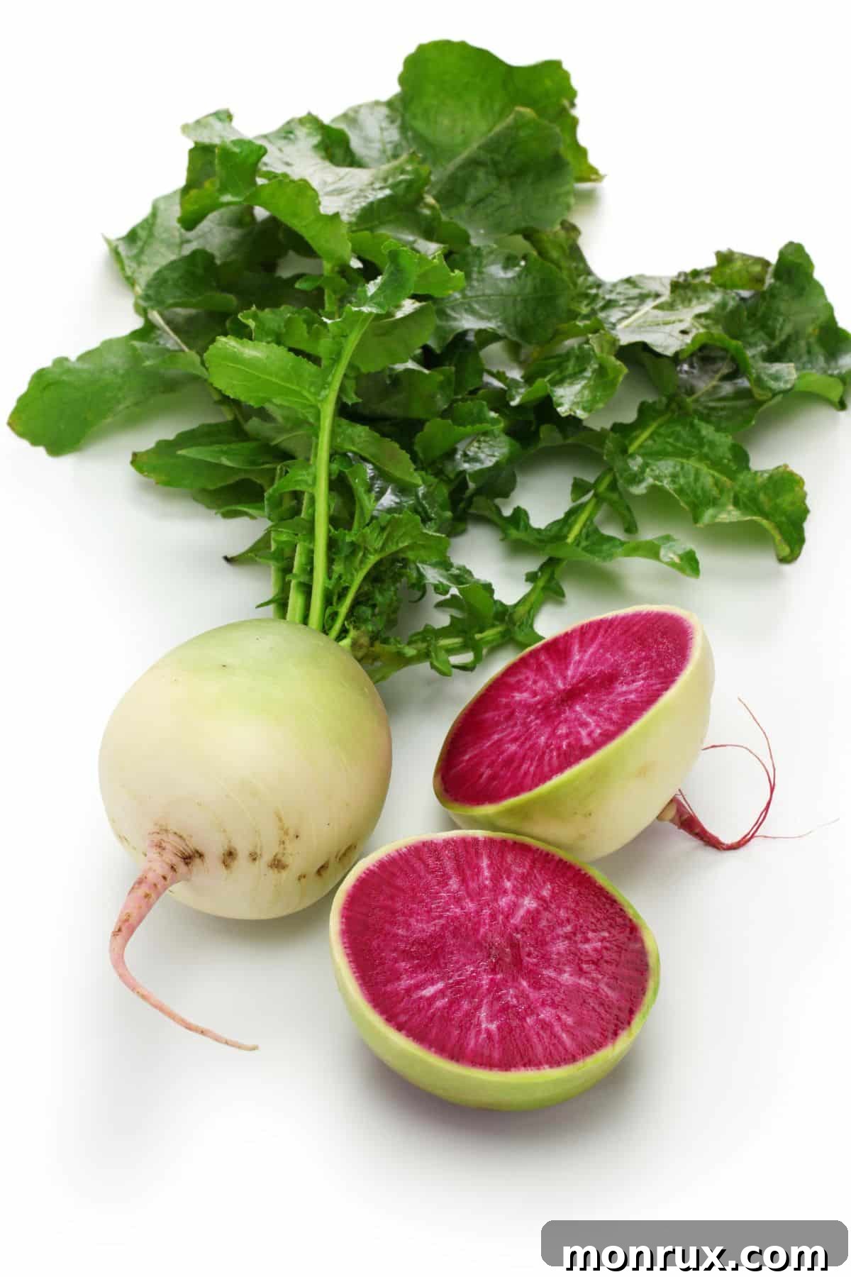 Watermelon radish slices beside whole radish.