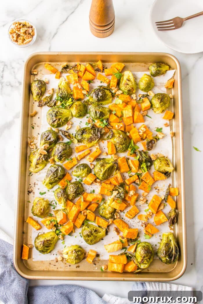 Golden-brown roasted Brussels sprouts and sweet potatoes fresh out of the oven.