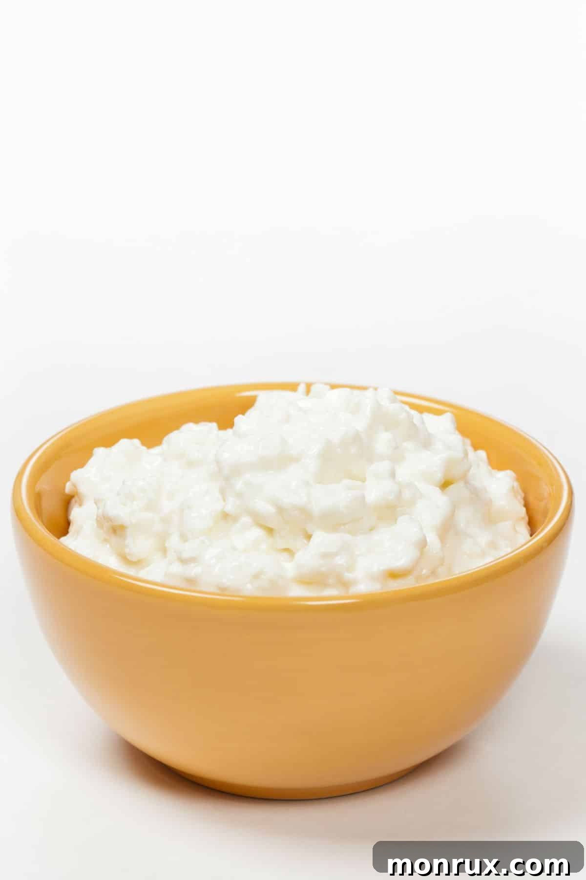 A bowl of fresh cottage cheese, a versatile and protein-rich soft food.