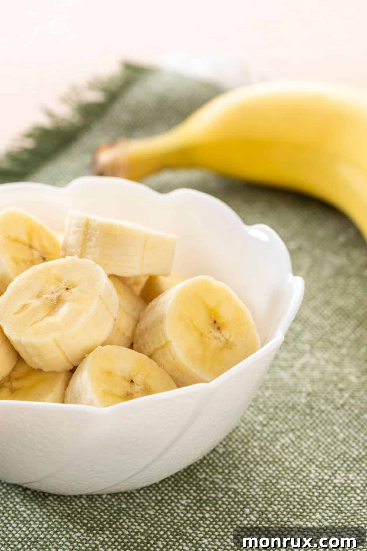 A ripe banana in a bowl, a naturally sweet and soft snack.