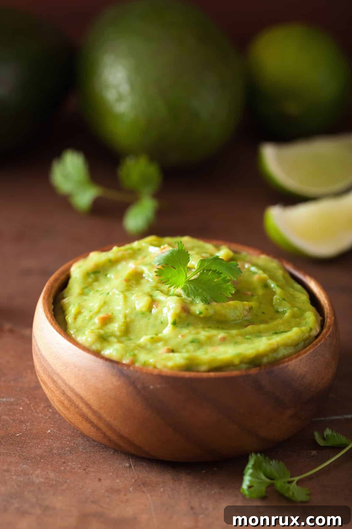 A bowl of creamy, soft guacamole, a nutritious and flavorful topping.
