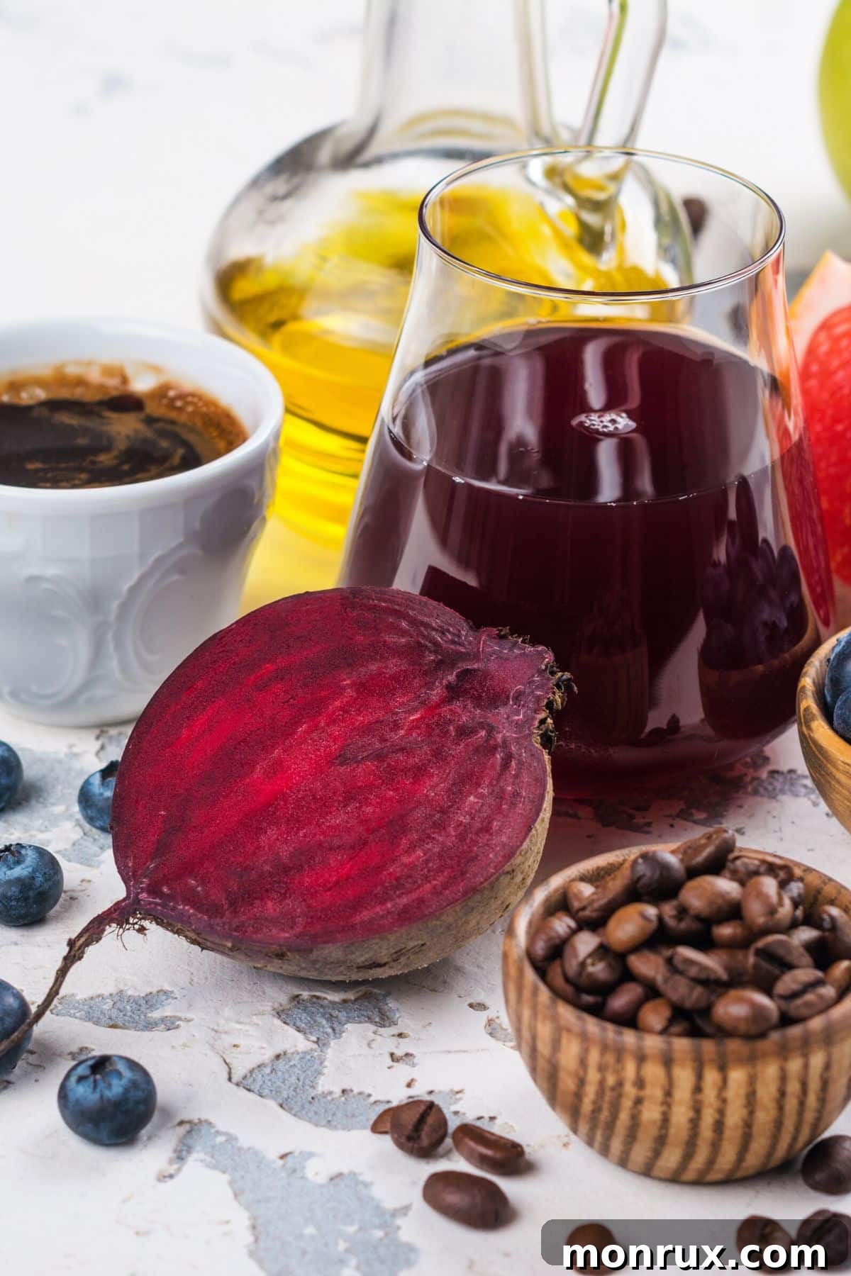Assortment of liver-supportive foods, including fruits, vegetables, and nuts, arranged on a rustic wooden table, emphasizing natural detoxification.