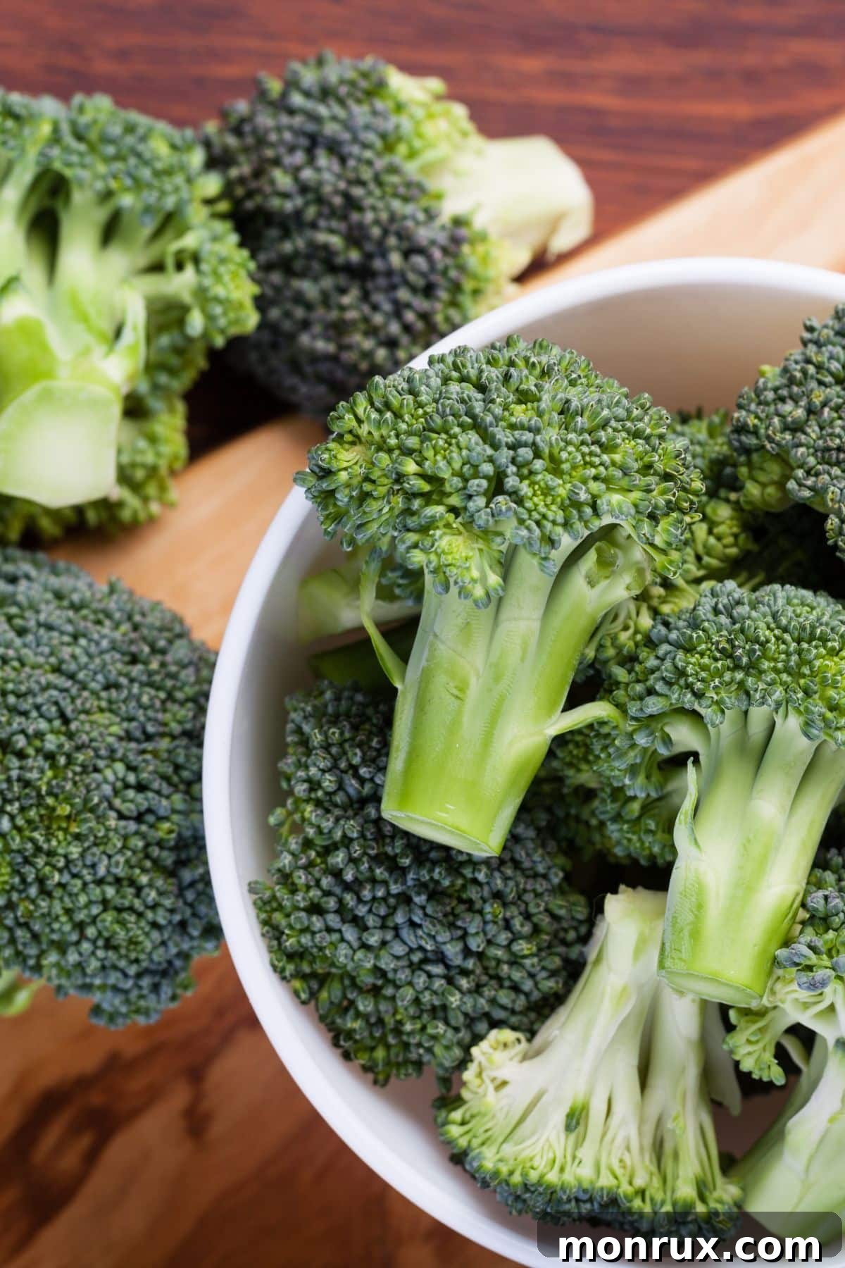 A vibrant bowl of fresh broccoli florets, highlighted as a top liver-supportive food.