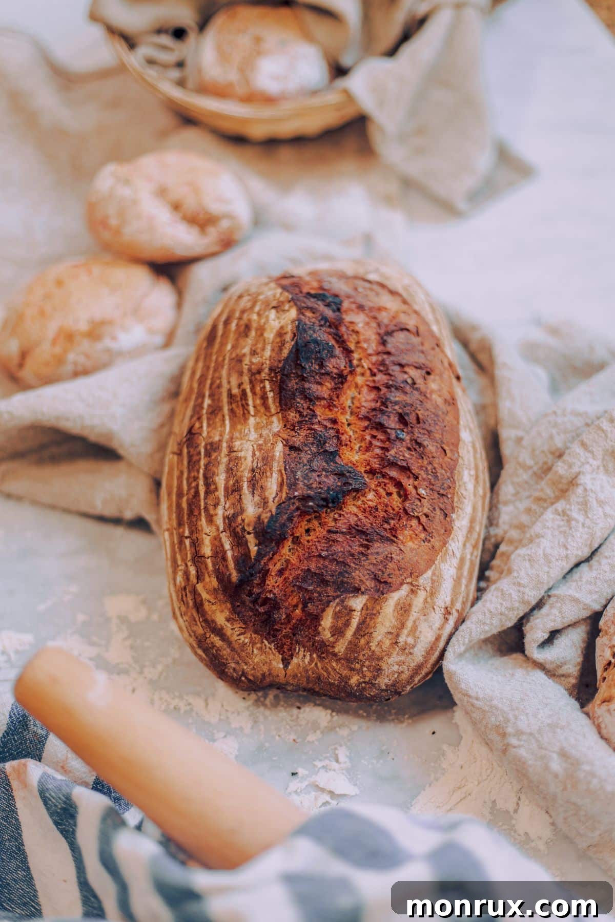 a loaf of sour dough bread on a table.