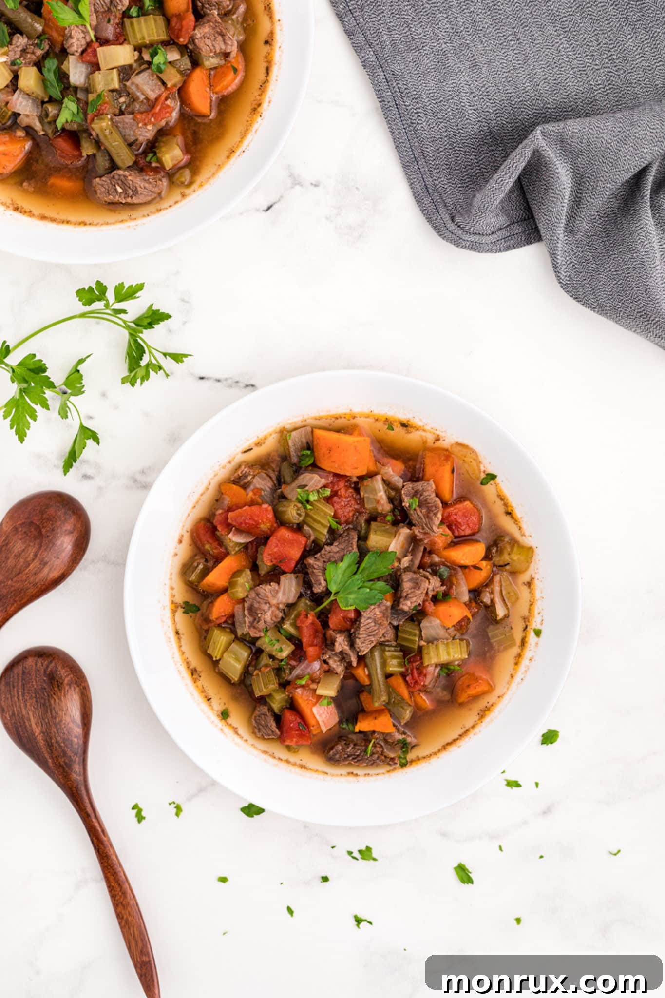 Two bowls of Instant Pot beef stew, showcasing a delicious meal.
