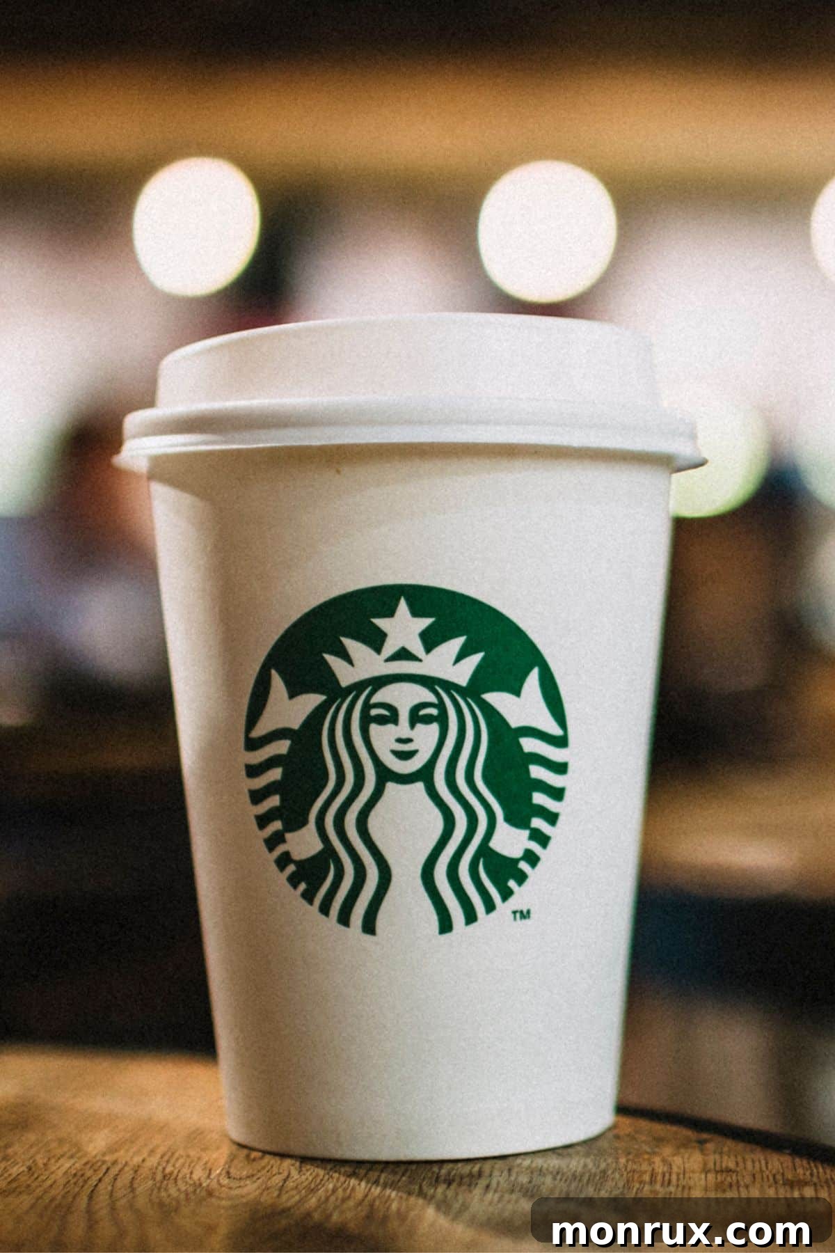 A perfectly brewed cup of Starbucks coffee resting on a rustic wooden table, ready to energize.
