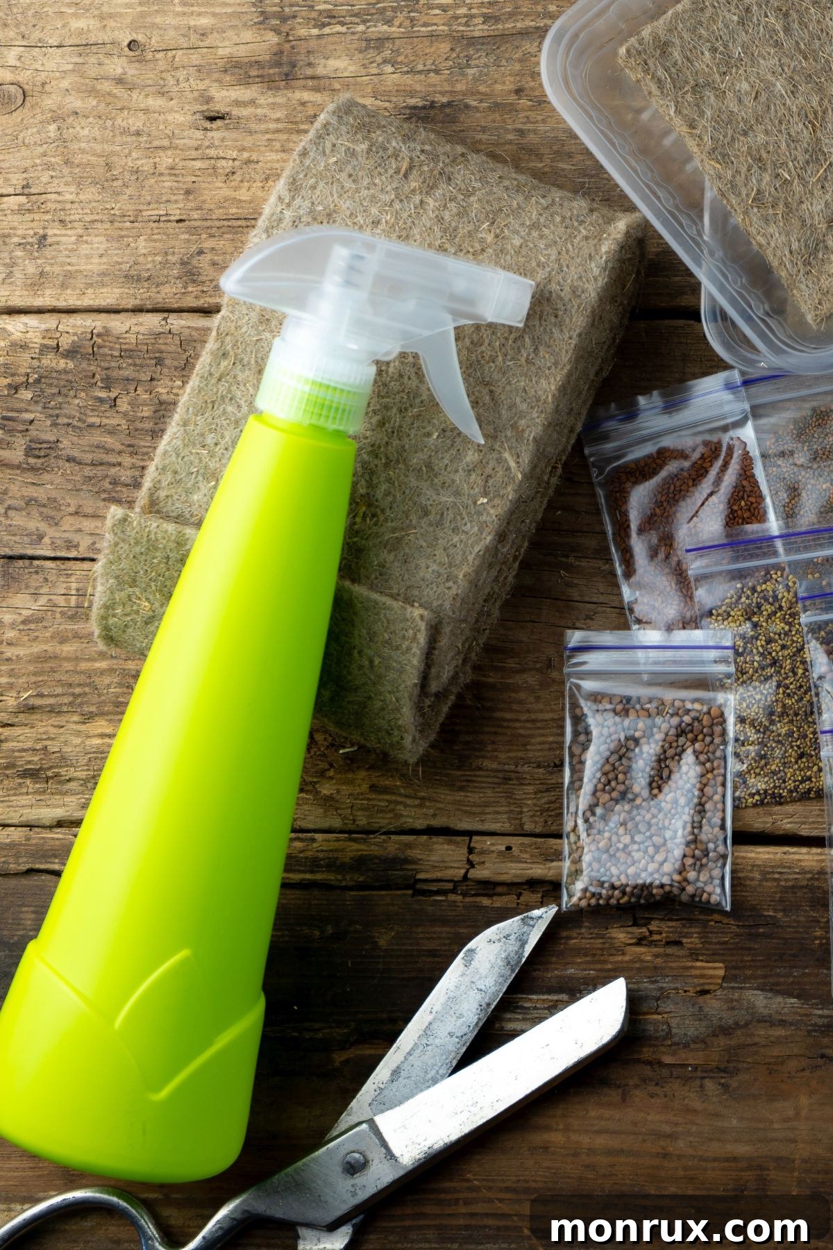 An organized setup of microgreen growing supplies on a table, including trays, soil, and seeds.
