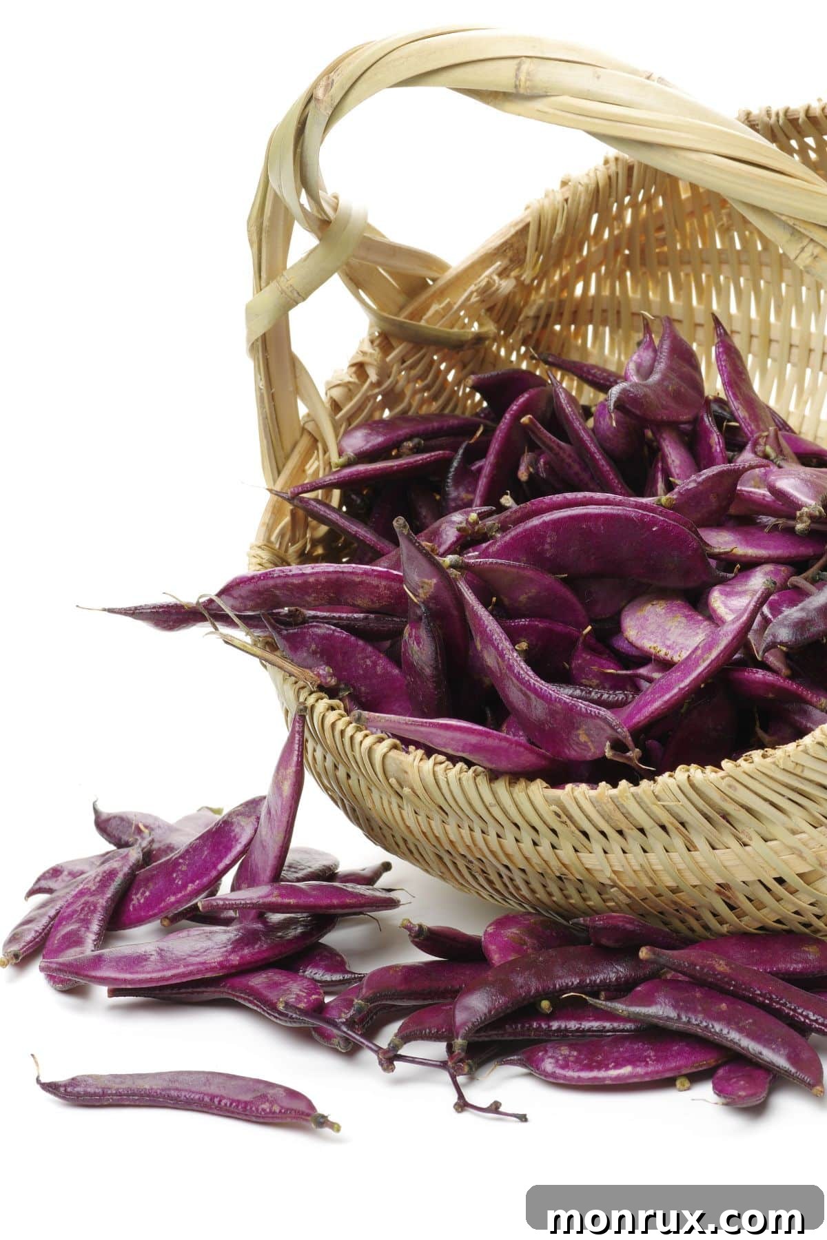 A vibrant basket brimming with fresh hyacinth beans, showcasing their rich color and inviting texture.