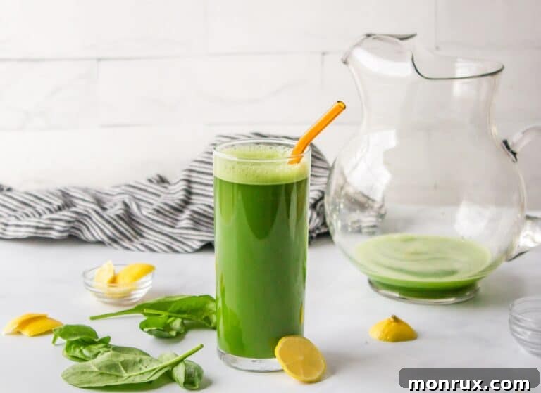 A glass of vibrant green spinach juice, suggesting health and freshness.