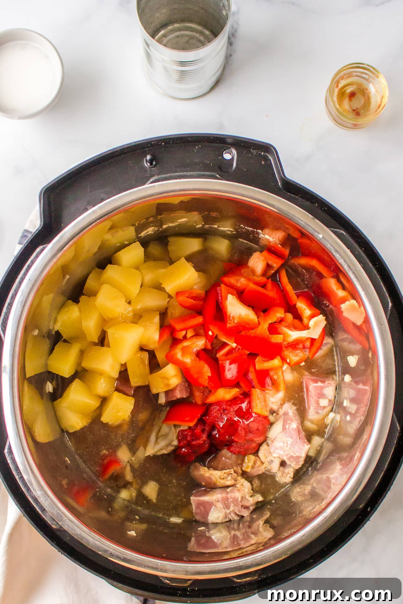 Pineapple and diced peppers with pork in an Instant Pot.