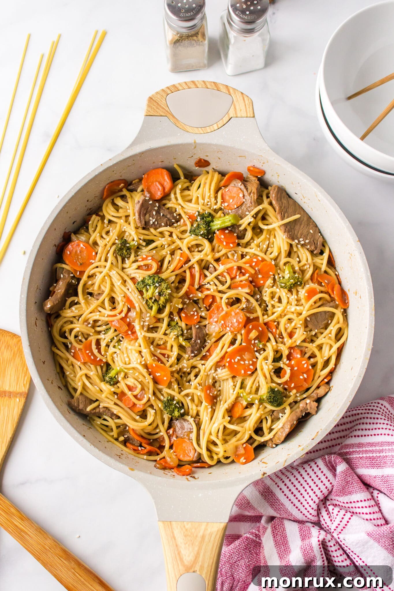 A delicious skillet of beef teriyaki noodle dish, freshly prepared and ready to be served.