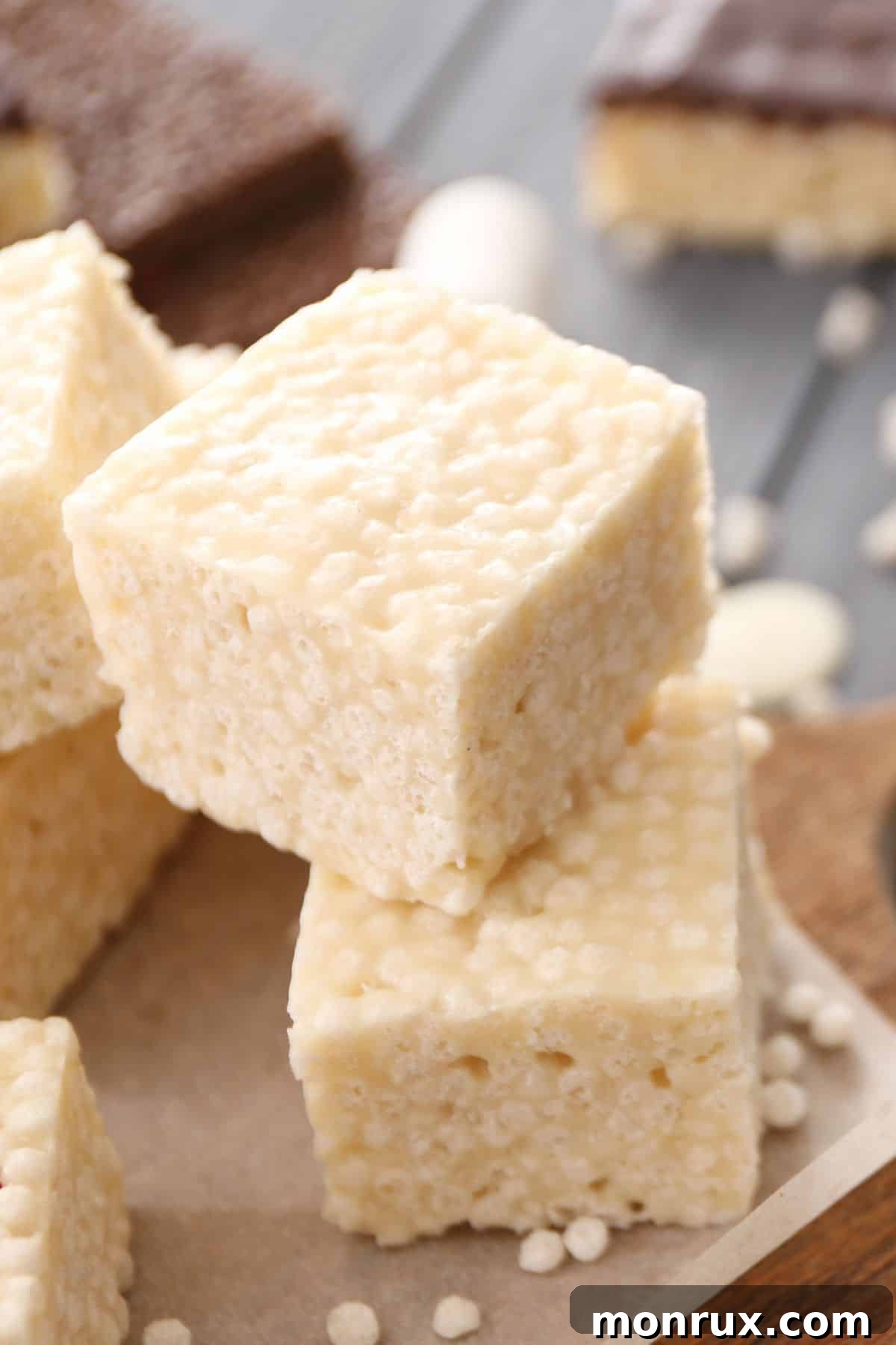homemade rice krispie treats on a cutting board.