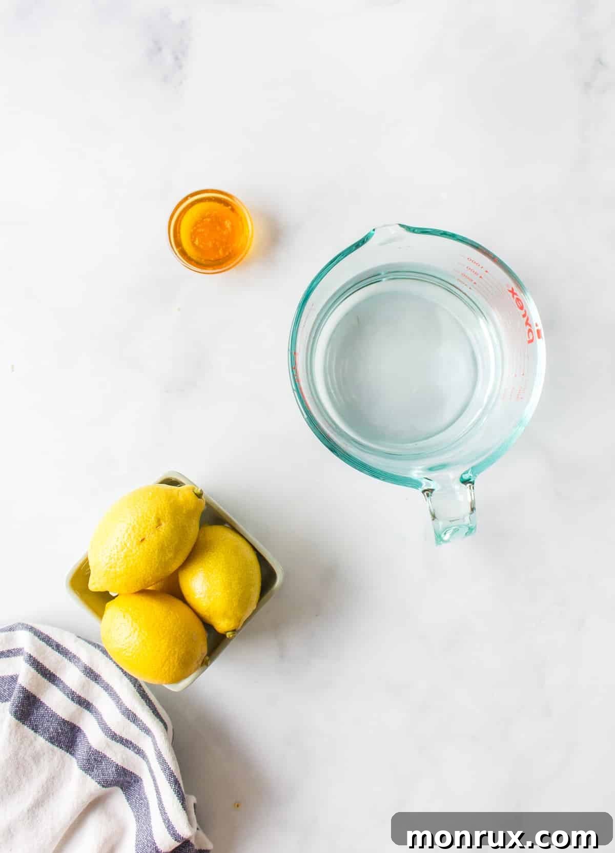 Ingredients for honey lemon tea on countertop.