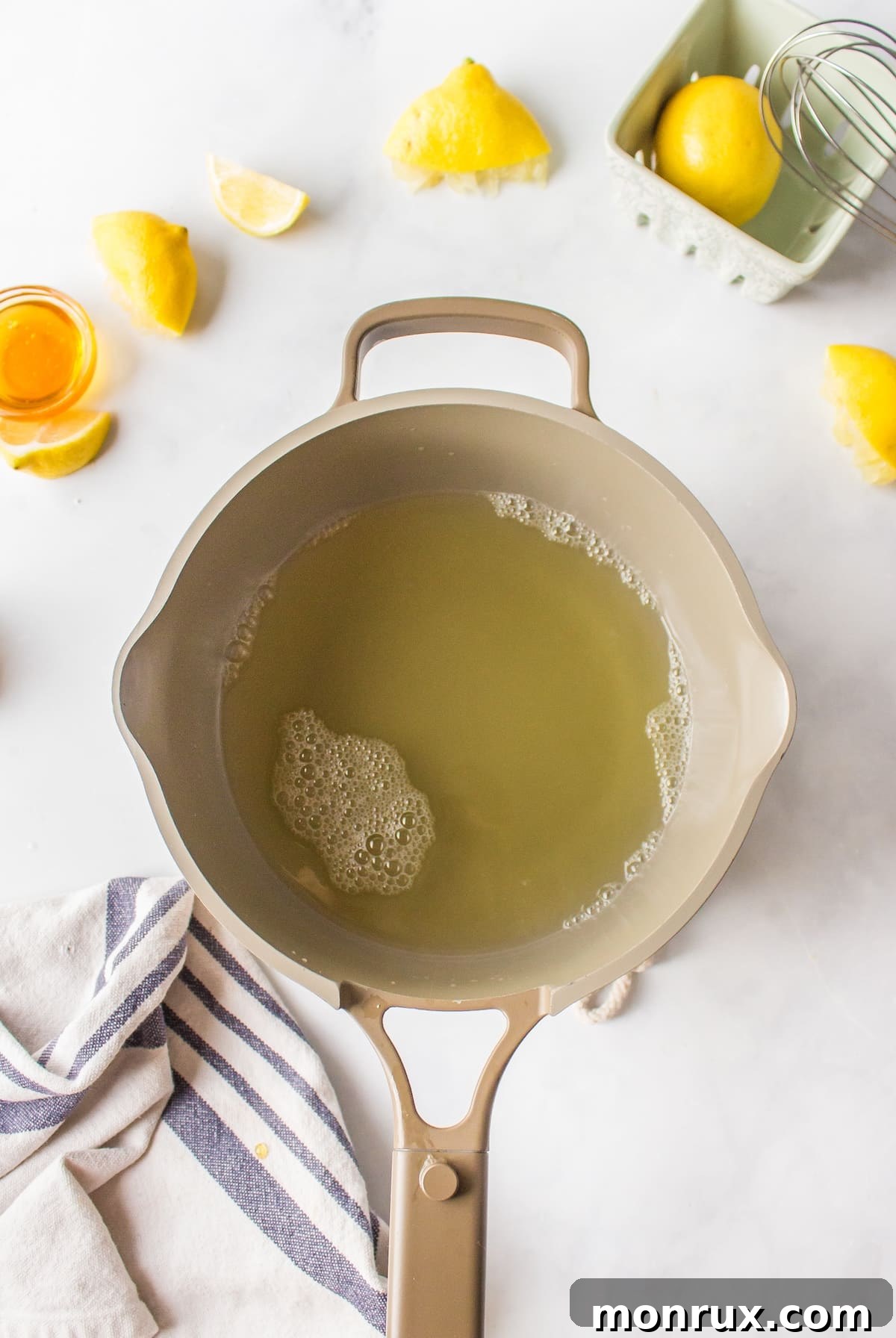 Lemon juice and water in saucepan.