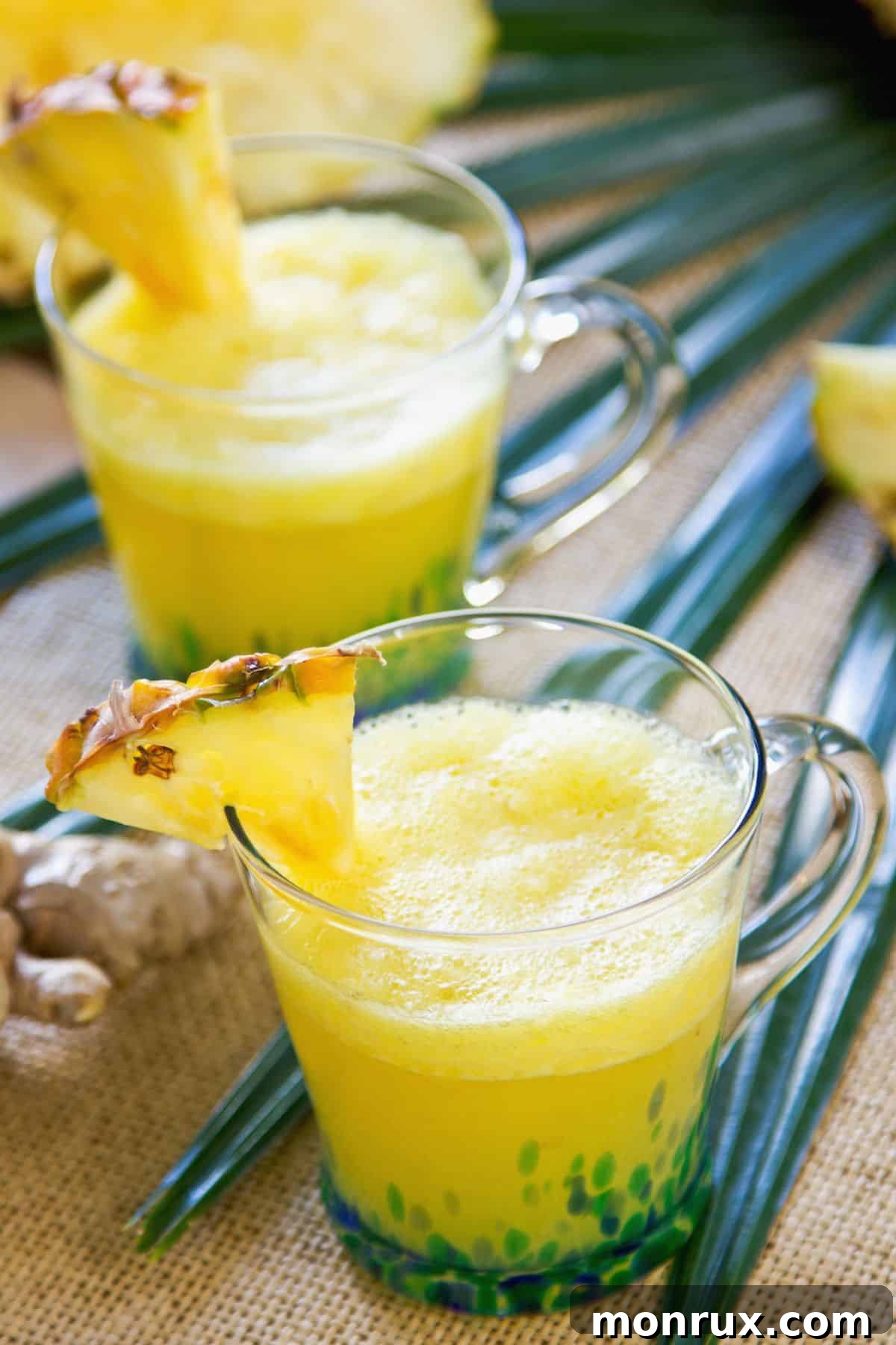 two glasses pineapple ginger juice.