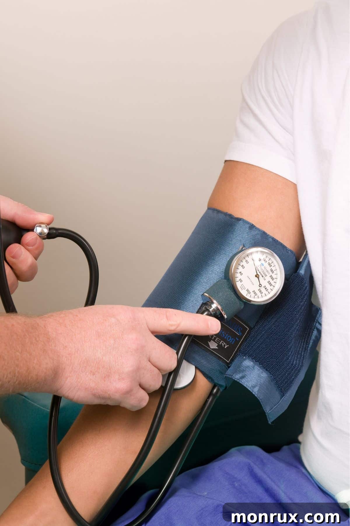 A doctor taking a person's blood pressure, symbolizing health monitoring.