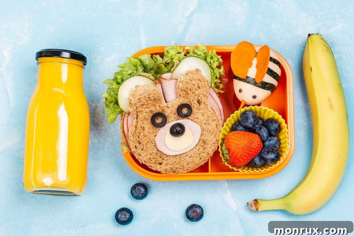 cute lunchbox with fun healthy food for a child, featuring vibrant fruits, vegetables, and a healthy sandwich.