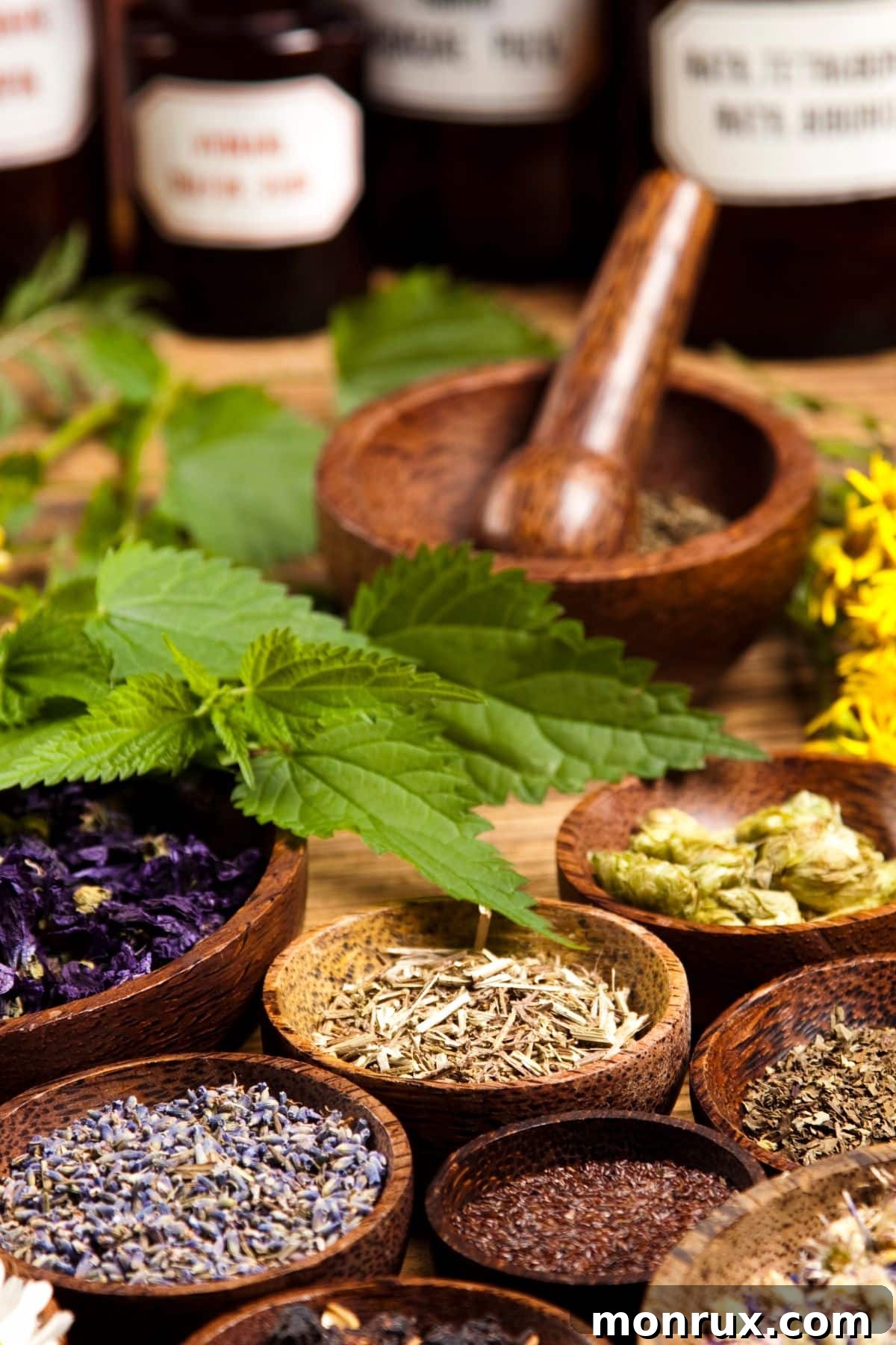 A vibrant selection of dried herbs, seeds, and spices arranged in wooden bowls and a rustic setting, symbolizing natural gut health remedies.