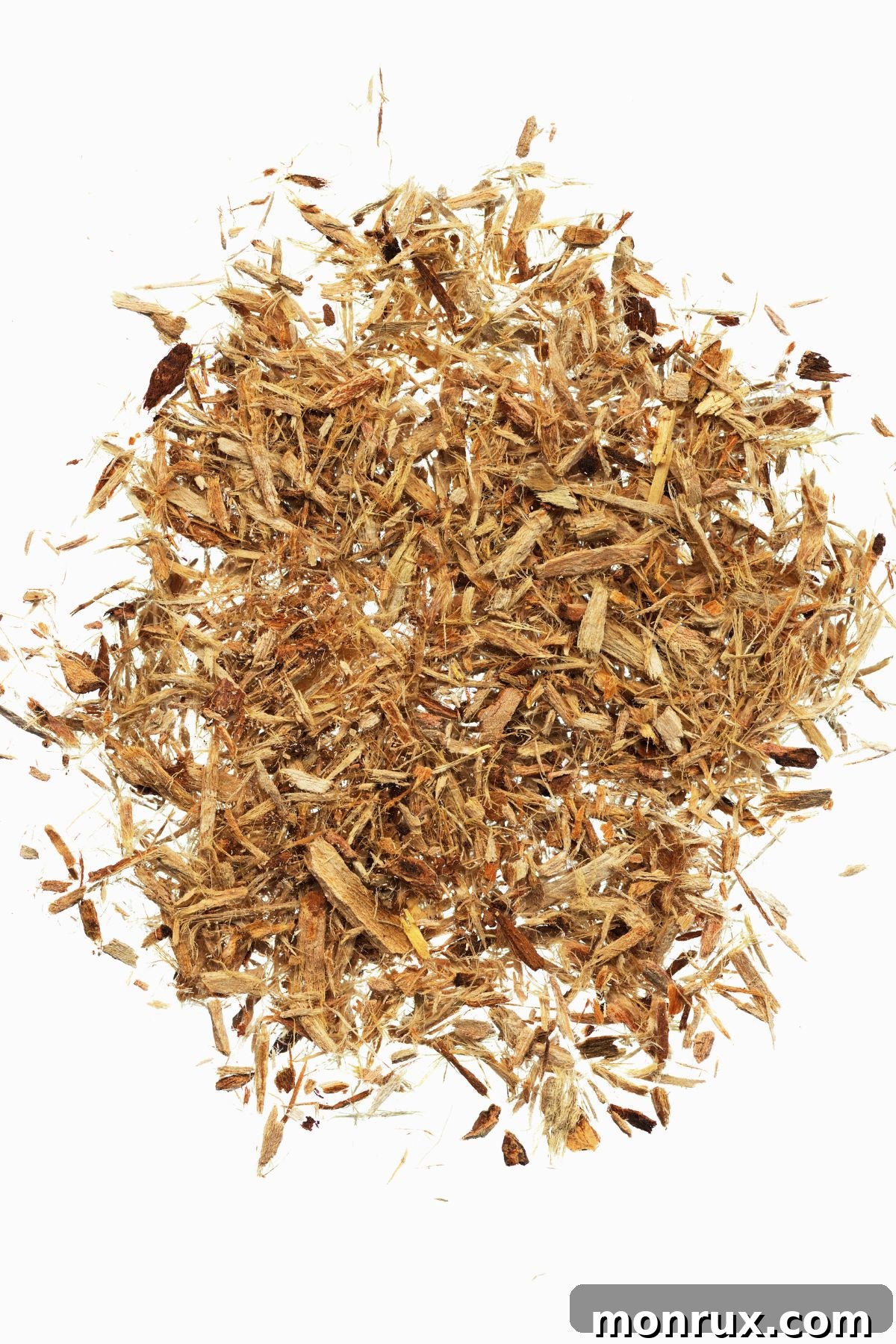 Small, reddish-brown pieces of slippery elm bark arranged neatly on a clean white background, highlighting its natural form.