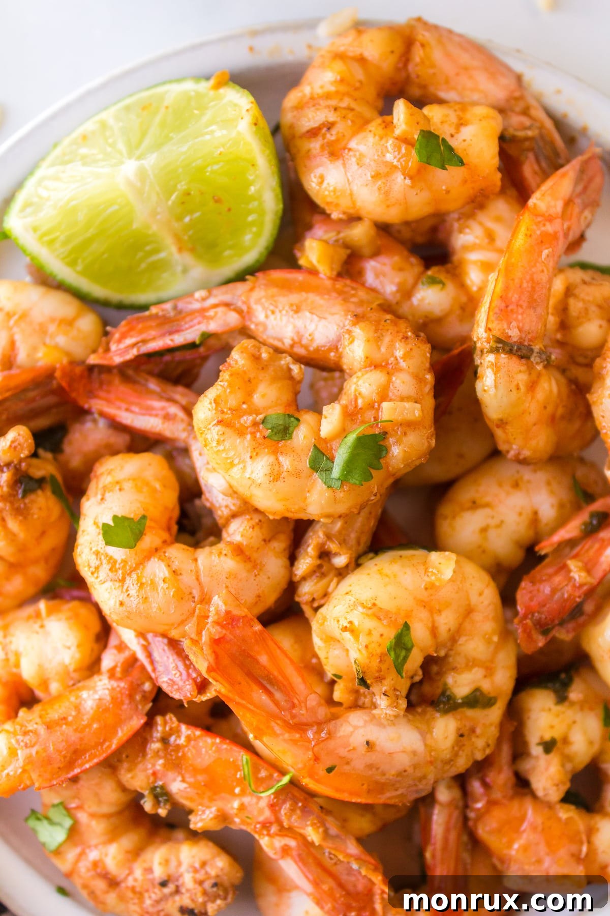 Freshly cooked cilantro lime shrimp in a serving bowl, ready to be garnished.