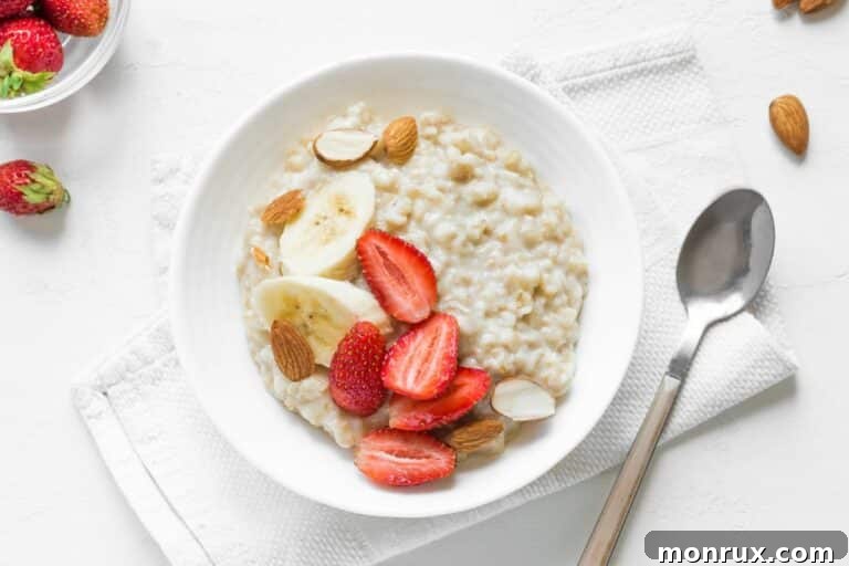 A beautiful bowl of oatmeal topped with fresh fruit, inviting and wholesome.