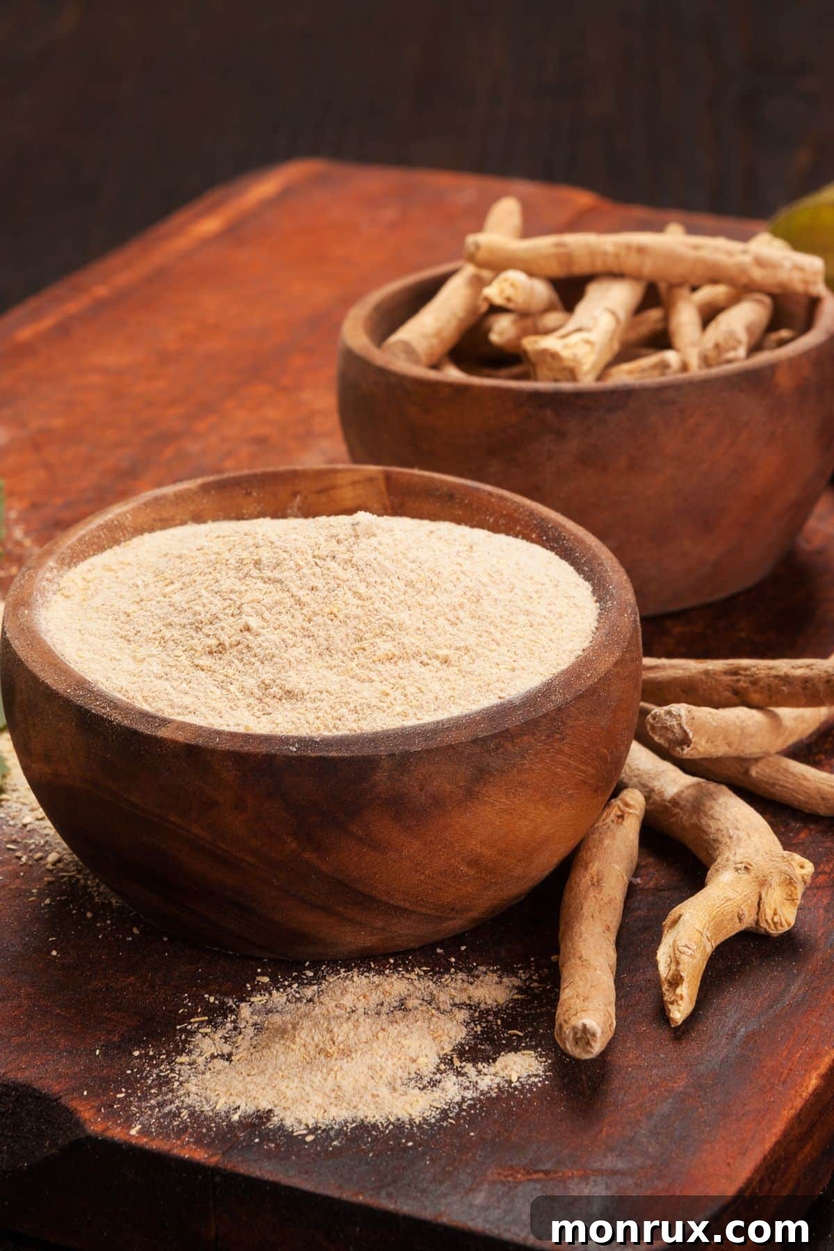 A bowl of powdered ashwagandha next to its dried root, symbolizing natural remedies for health.