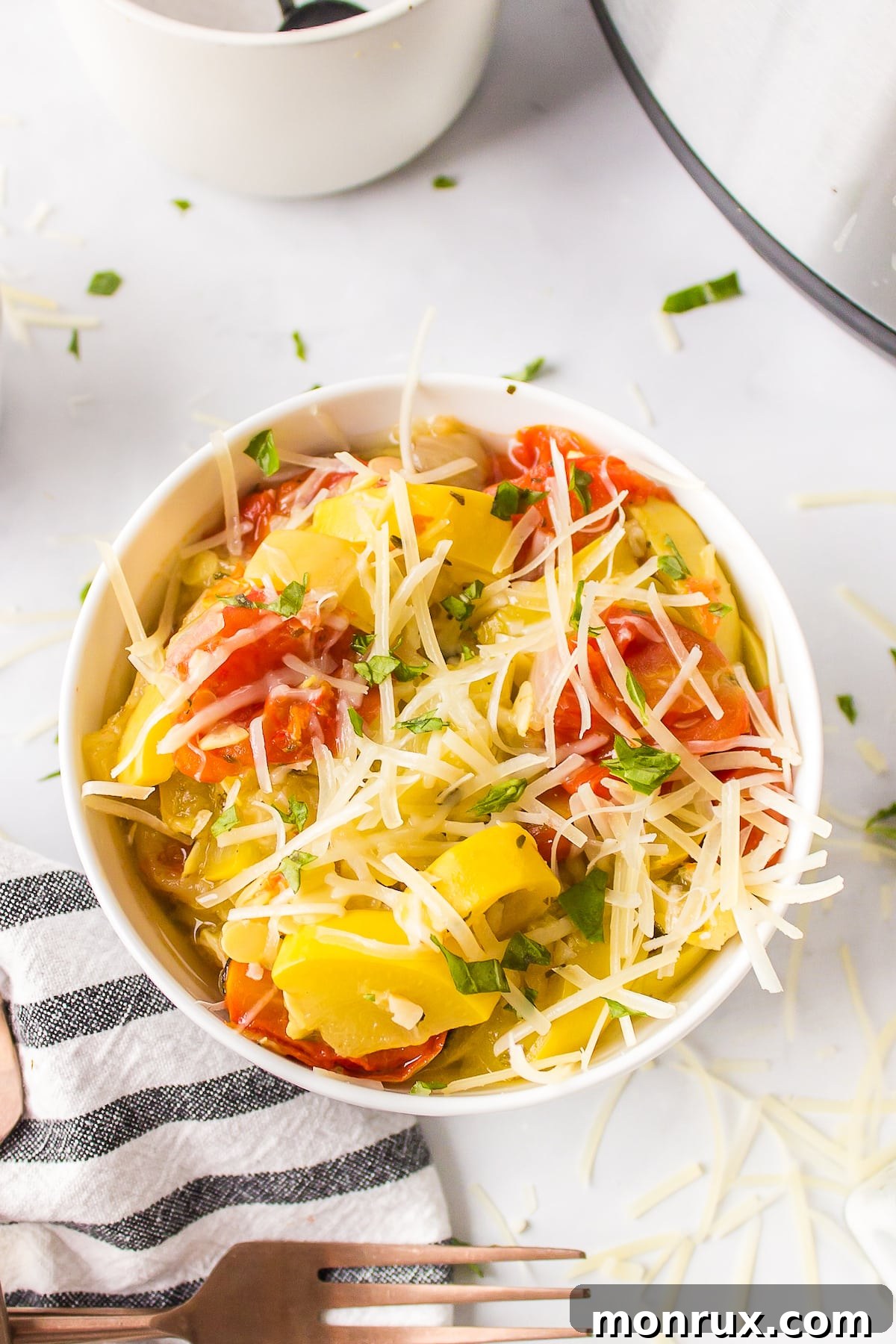 A vibrant bowl of Instant Pot Yellow Squash and Tomatoes, ready to be served.