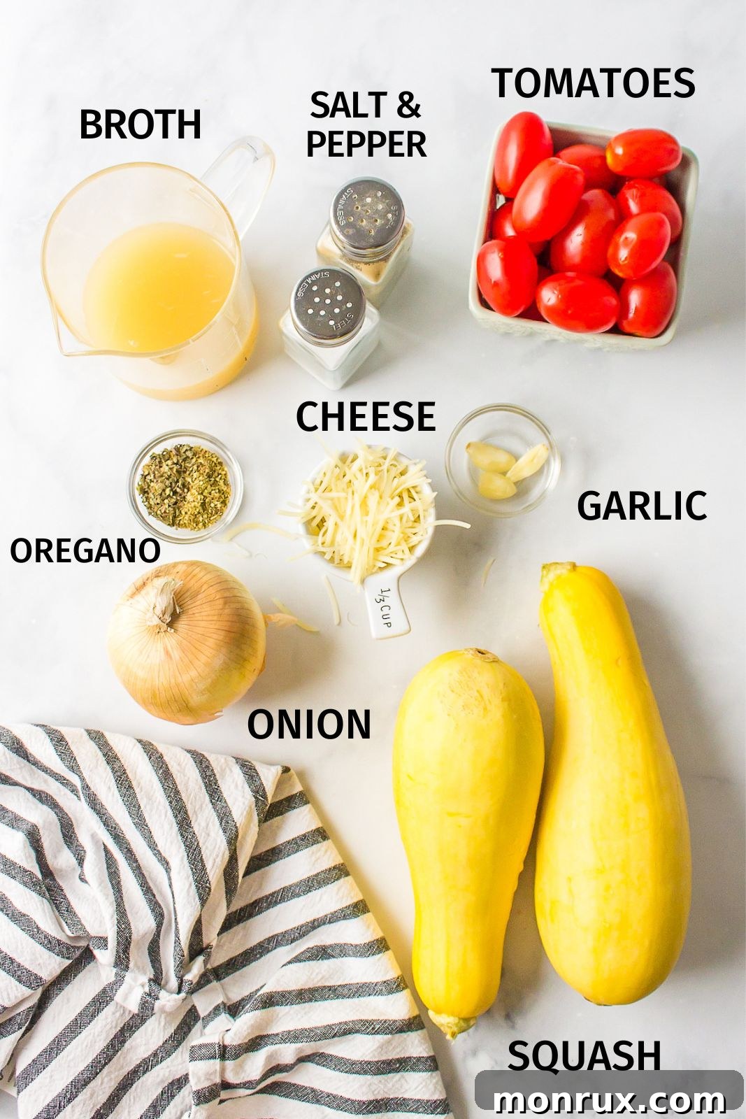 A selection of fresh ingredients laid out on a kitchen counter for Instant Pot Yellow Squash and Tomatoes.