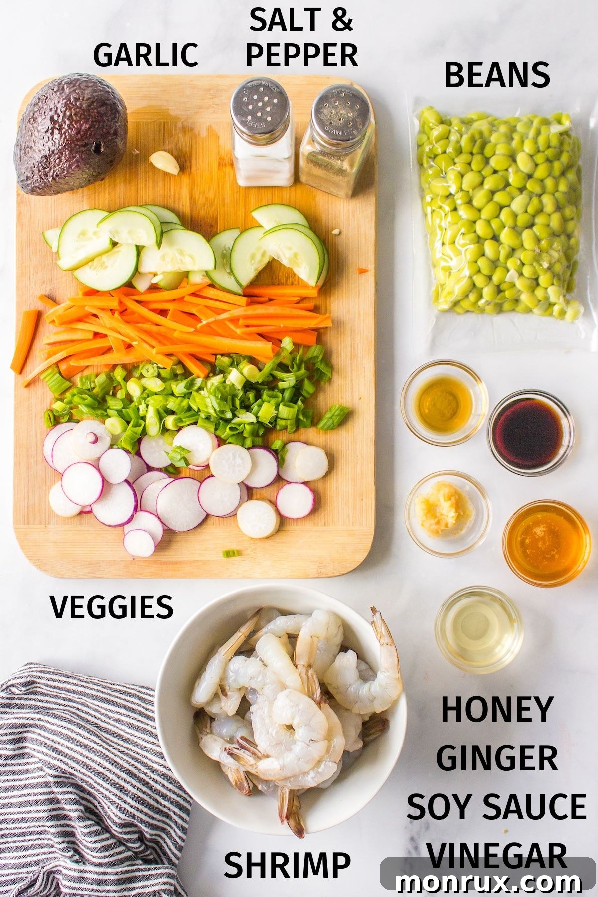 A vibrant selection of fresh ingredients laid out for shrimp poke bowls.