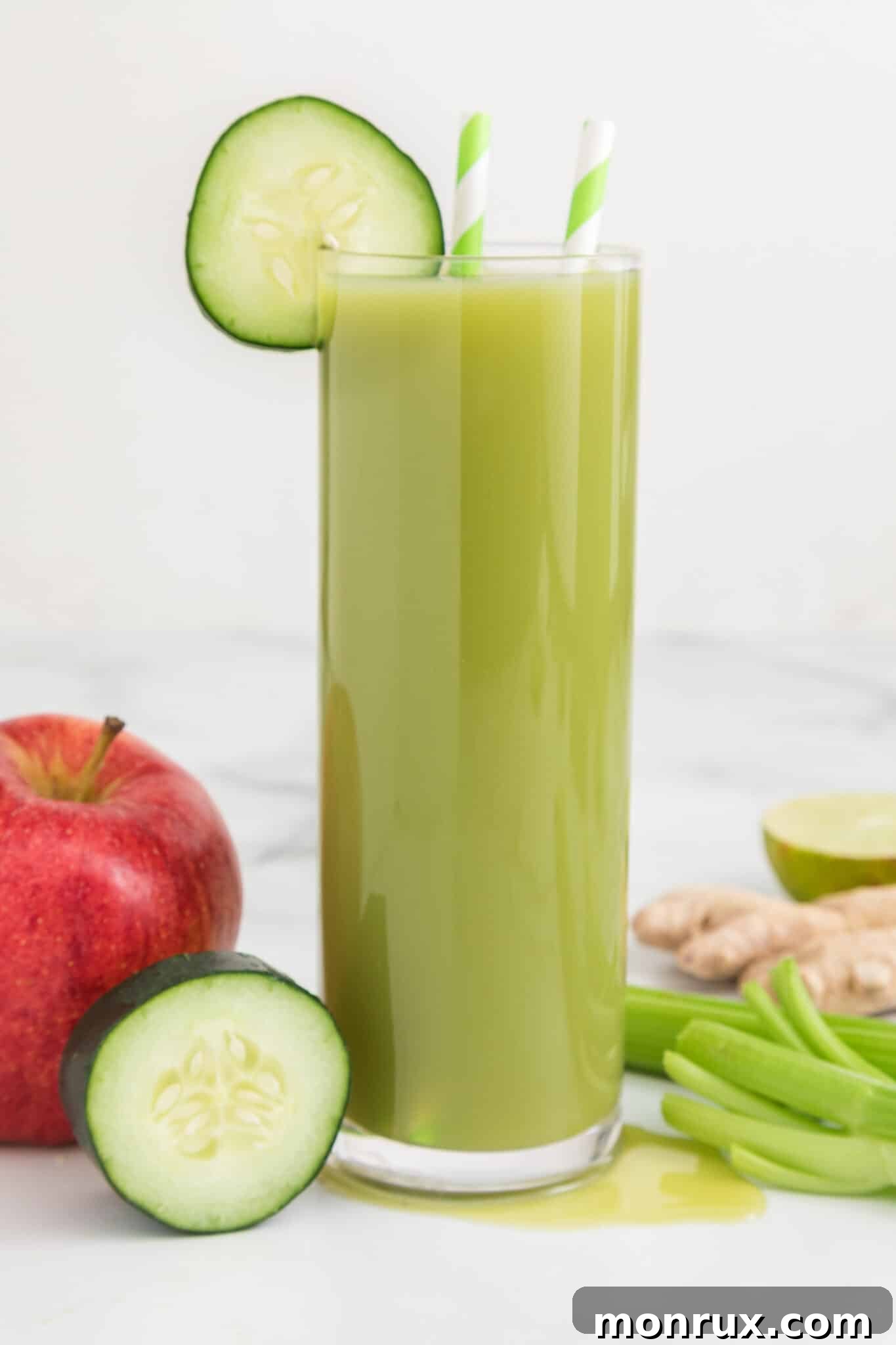 glass of celery cucumber juice on table.