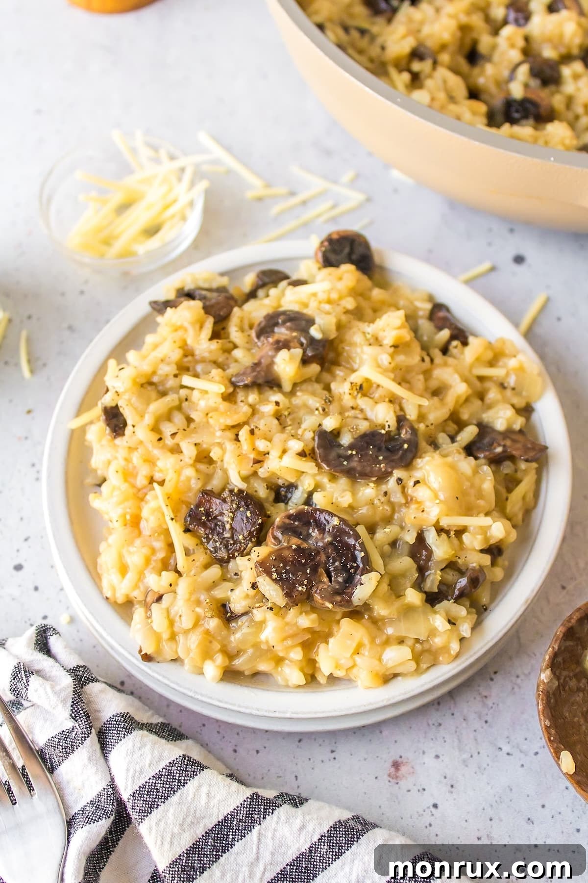 A beautifully plated bowl of gluten-free mushroom risotto, garnished with fresh herbs, showcasing its creamy texture.