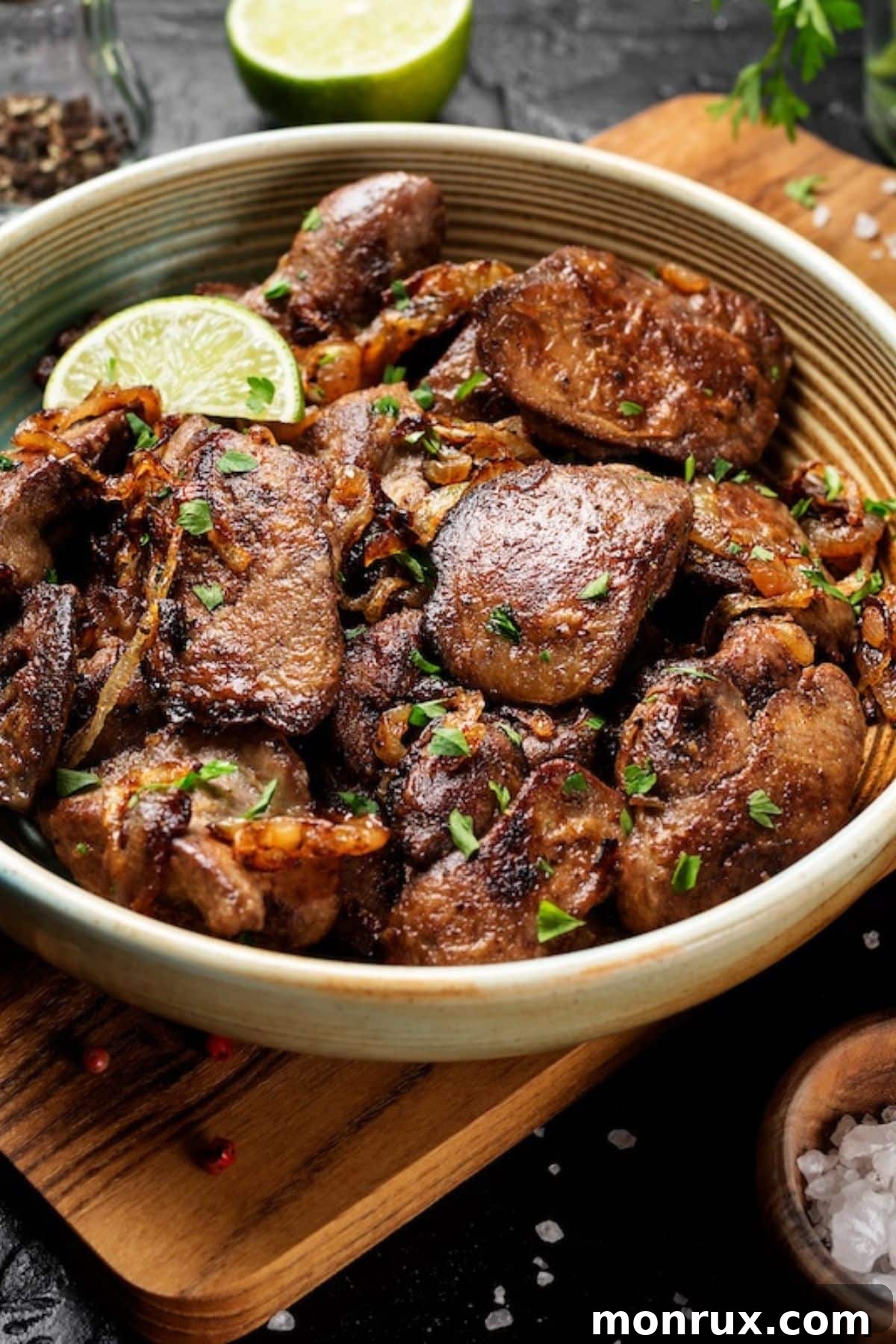A bowl of cooked chicken liver, prepared and ready to eat.