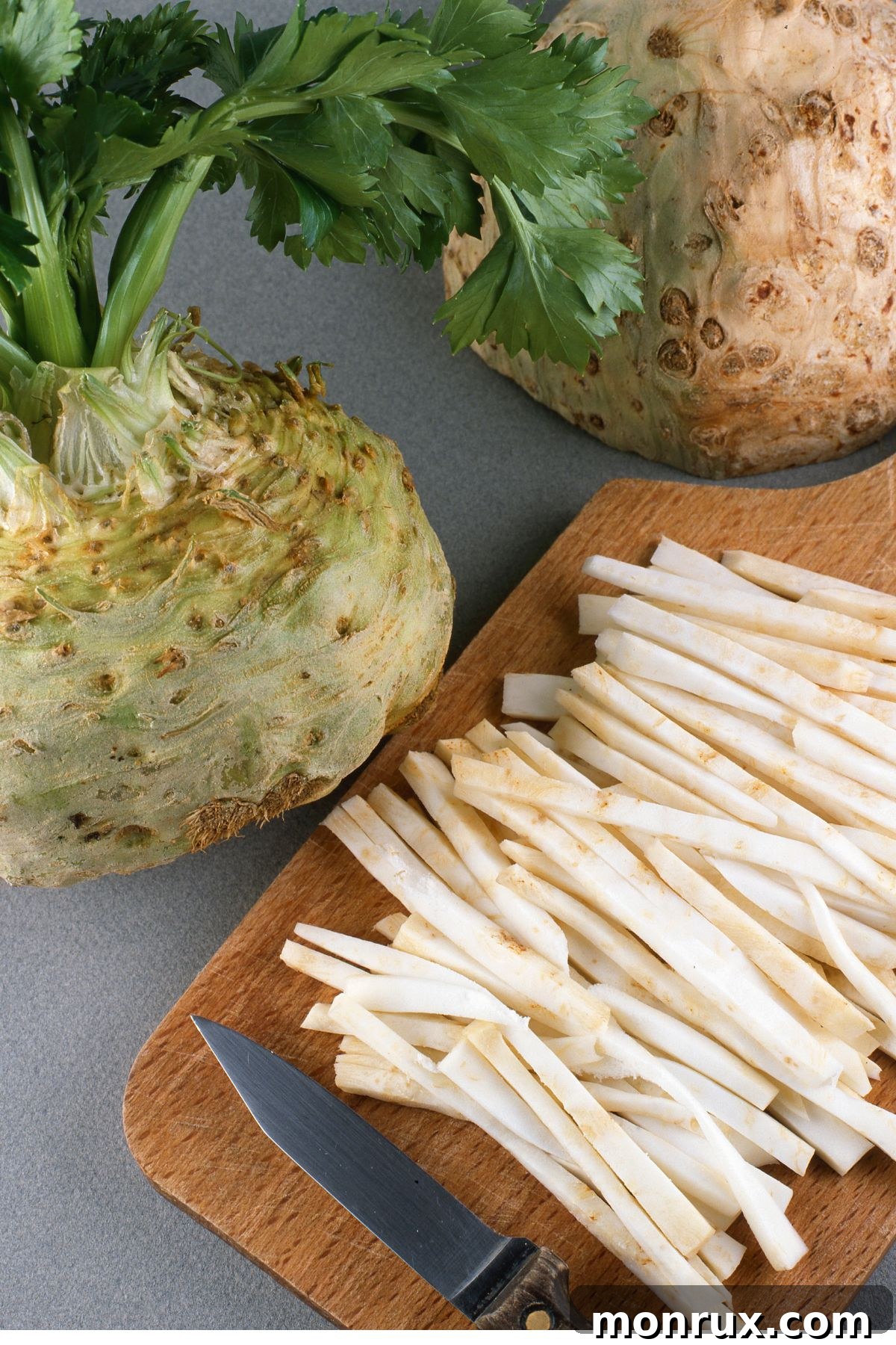 Sliced celeriac on a cutting board, revealing its unique texture and color.
